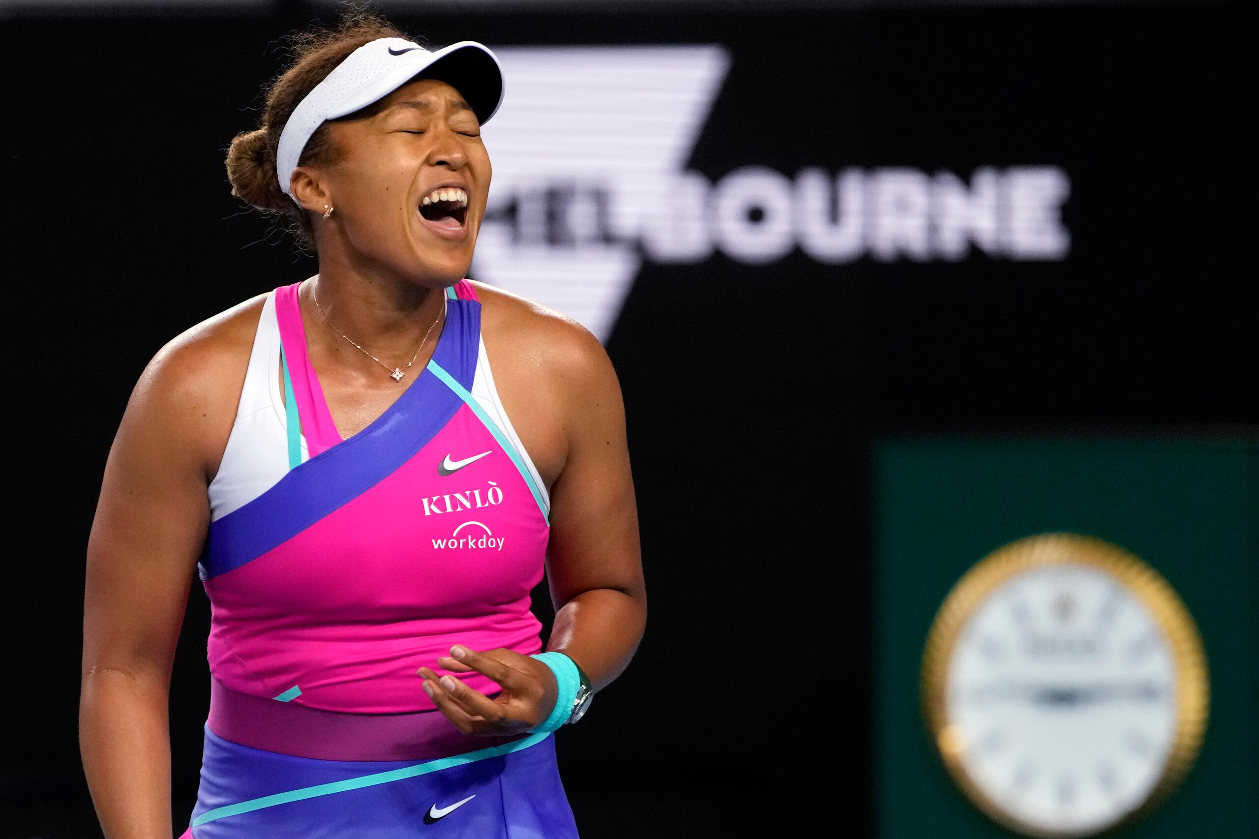 Naomi Osaka of Japan reacts during her third round match against Amanda Anisimova of the U.S. at the Australian Open tennis championships in Melbourne, Australia, Friday, Jan. 21, 2022. (AP Photo/Simon Baker)