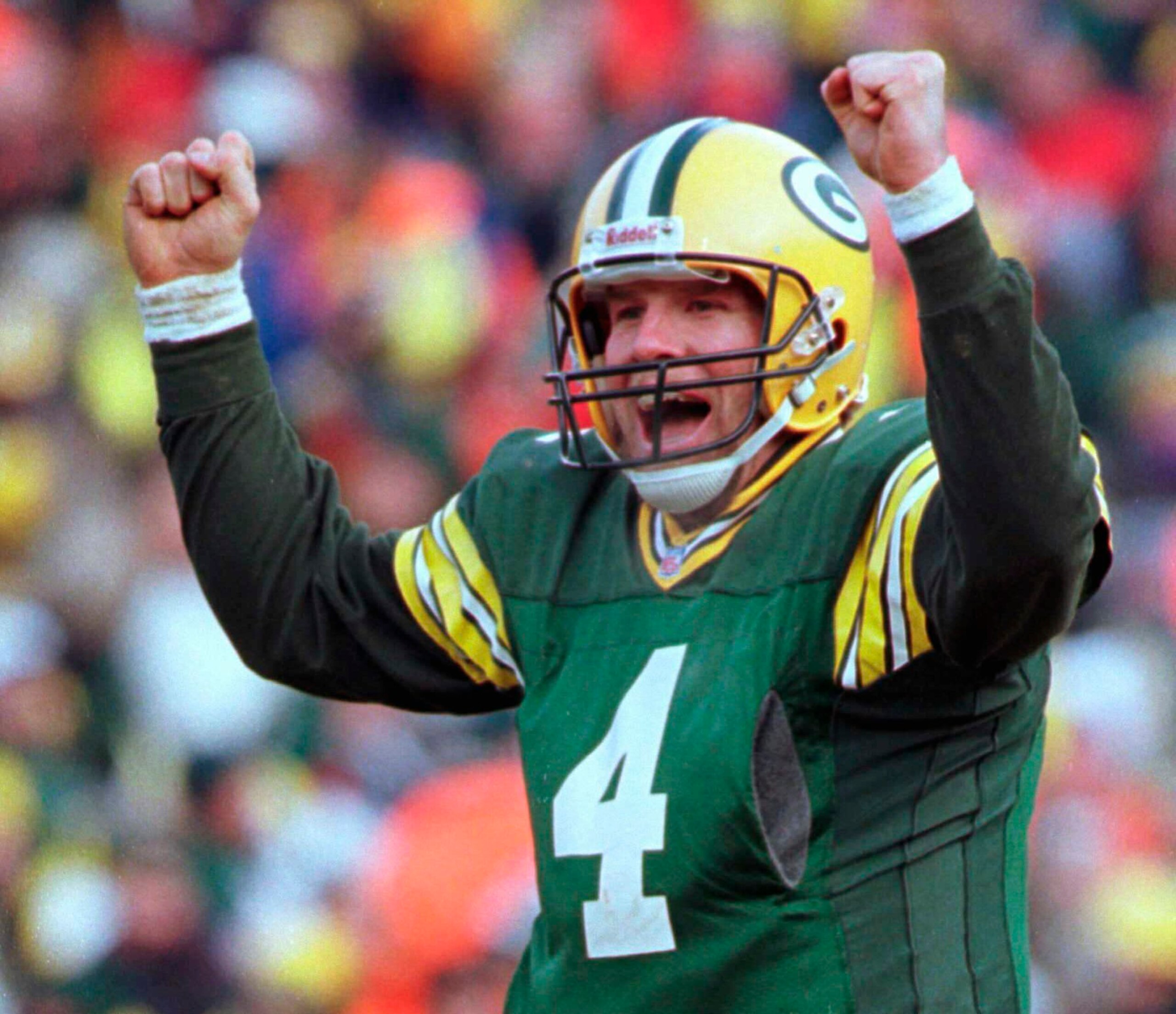 FILE - In this Sunday, Jan. 12, 1997, file photo, Green Bay Packers quarterback Brett Favre celebrates in the fourth quarter of a 30-13 win against the Carolina Panthers in the NFC Championship game at Lambeau Field in Green Bay, Wis. The Packers have reached another NFC championship game, finally returning it to Lambeau Field. The Packers will play the Tampa Bay Buccaneers on Sunday, Jan. 24, 2021.(AP Photo/Mark Duncan, File)