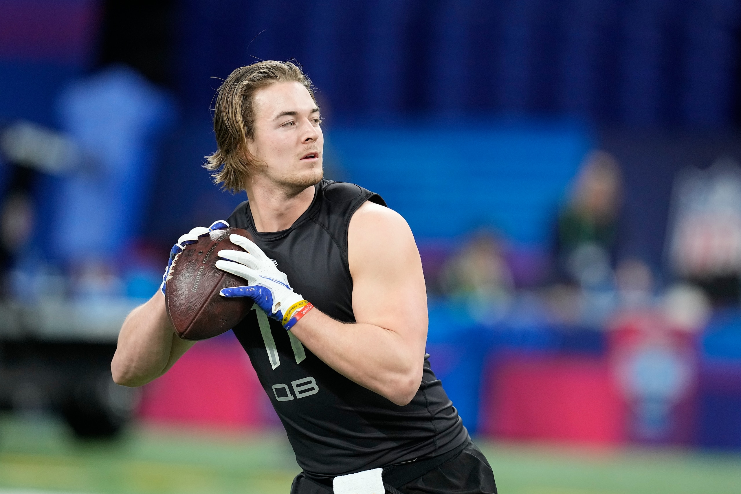 Pittsburgh quarterback Kenny Pickett runs a drill during the NFL football scouting combine, Thursday, March 3, 2022, in Indianapolis. (AP Photo/Darron Cummings)