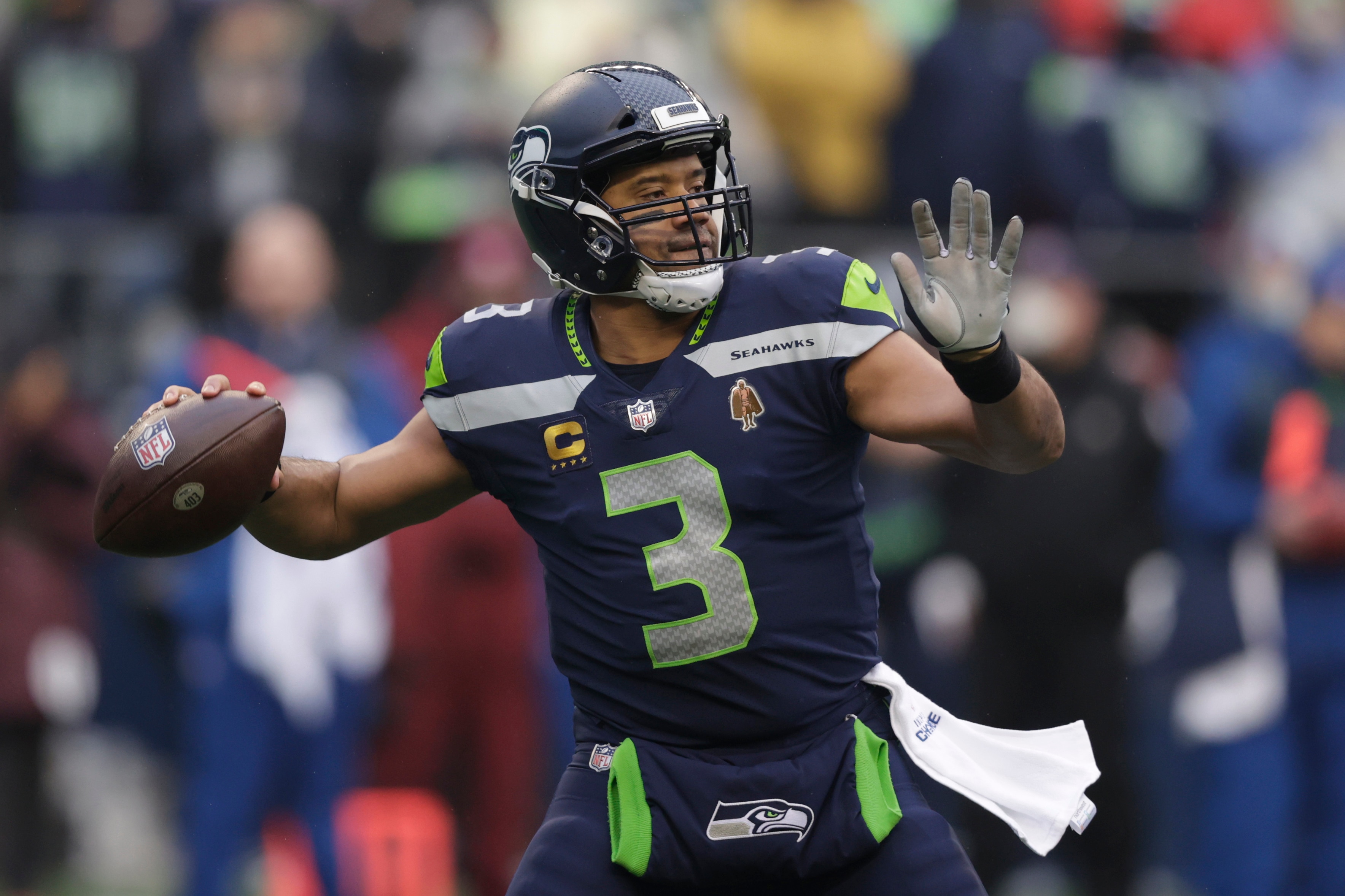 FILE -Seattle Seahawks quarterback Russell Wilson passes against the Detroit Lions during the first half of an NFL football game, Sunday, Jan. 2, 2022, in Seattle. The Seattle Seahawks have agreed to trade nine-time Pro Bowl quarterback Russell Wilson to the Denver Broncos for a massive haul of draft picks and players, two people familiar with the negotiations confirmed to The Associated Press on Tuesday, March 8, 2022. The people spoke on condition of anonymity because the blockbuster trade, which is pending Wilson passing a physical, can't become official until the start of the new league year on March 16. (AP Photo/John Froschauer, File)