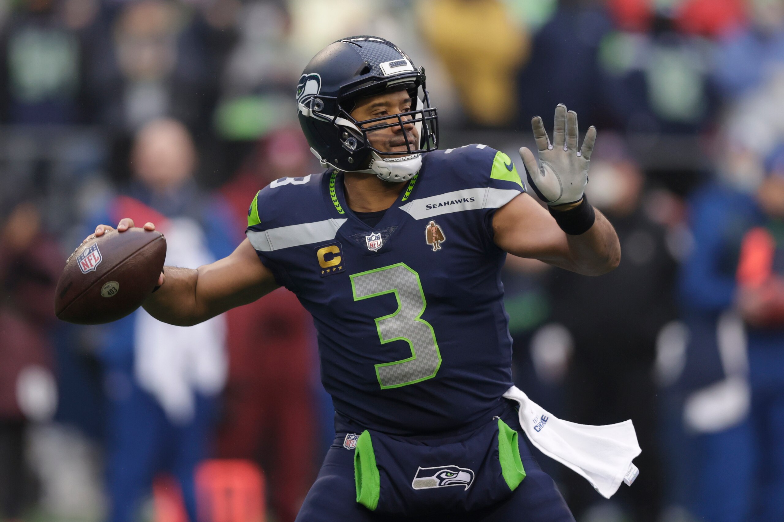 FILE -Seattle Seahawks quarterback Russell Wilson passes against the Detroit Lions during the first half of an NFL football game, Sunday, Jan. 2, 2022, in Seattle. The Seattle Seahawks have agreed to trade nine-time Pro Bowl quarterback Russell Wilson to the Denver Broncos for a massive haul of draft picks and players, two people familiar with the negotiations confirmed to The Associated Press on Tuesday, March 8, 2022. The people spoke on condition of anonymity because the blockbuster trade, which is pending Wilson passing a physical, can't become official until the start of the new league year on March 16. (AP Photo/John Froschauer, File)
