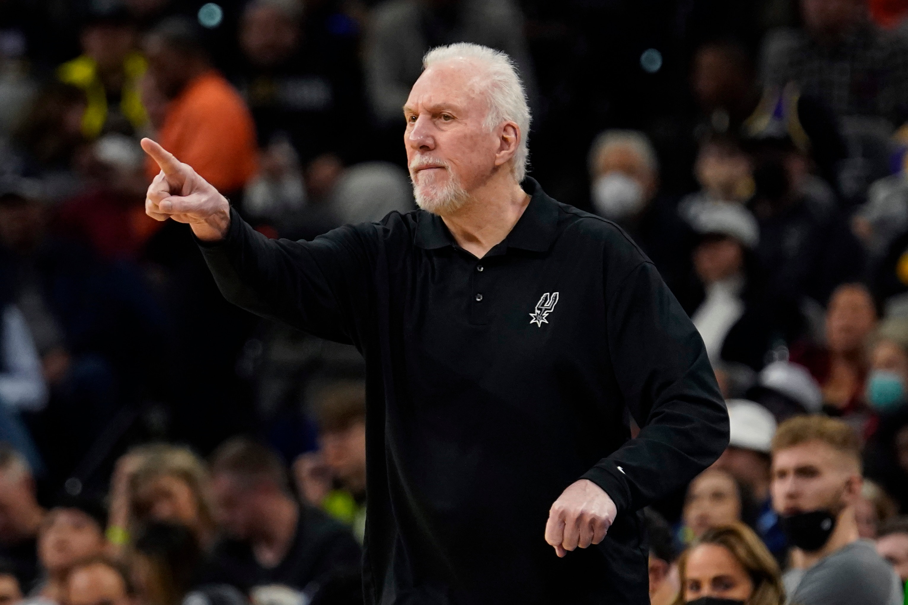 San Antonio Spurs head coach Gregg Popovich signals to his players during the first half of an NBA basketball game against the Los Angeles Lakers, Monday, March 7, 2022, in San Antonio. (AP Photo/Eric Gay)