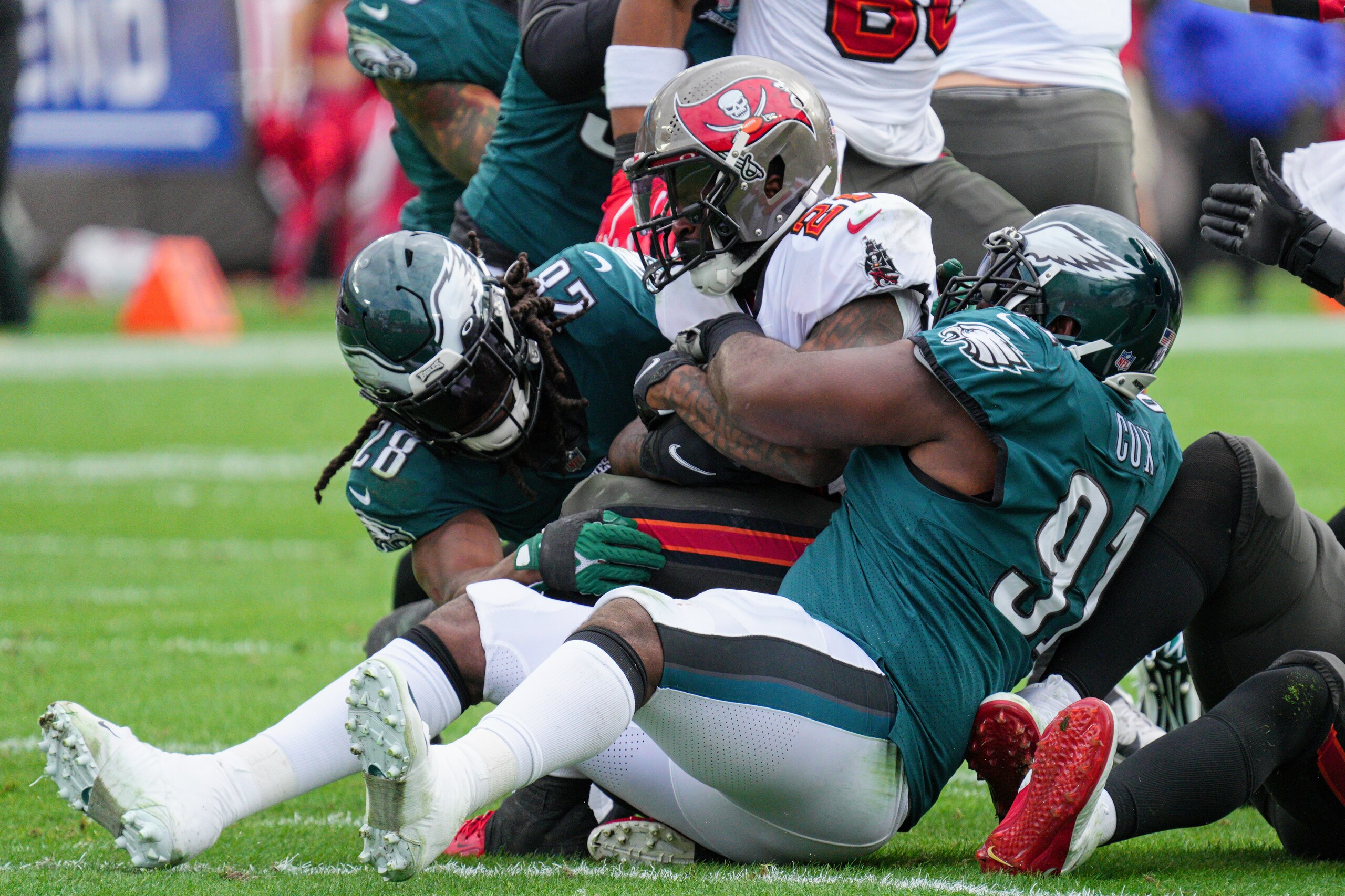 TAMPA, FL - JANUARY 16: Philadelphia Eagles defensive tackle Fletcher Cox (91) tackles Tampa Bay Buccaneers running back Ke'Shawn Vaughn (21) for a loss during the game between the Philadelphia Eagles and the Tampa Bay Buccaneers on January 16, 2022 at  Raymond James Stadium in Tampa, FL. (Photo by Andy Lewis/Icon Sportswire via Getty Images)