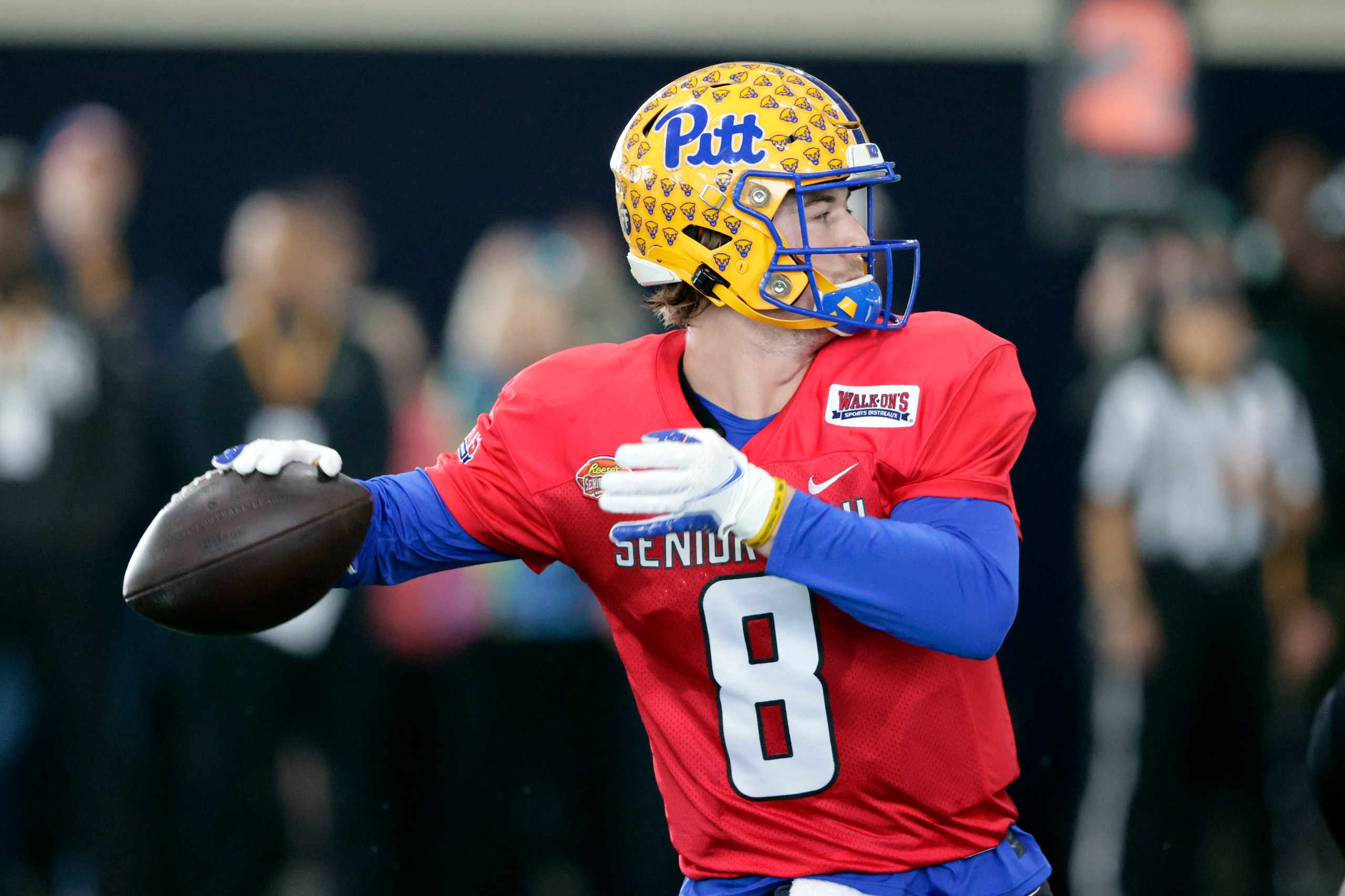 National Team quarterback Kenny Pickett of Pittsburgh (8) runs through drills during practice for the Senior Bowl NCAA college football game Thursday, Feb. 3, 2022, in Mobile, Ala. In an NFL draft where it seems unlikely for a passer to be the top overall NFL draft pick, that means a competition among players like Pittsburgh’s Kenny Pickett, North Carolina’s Sam Howell and Liberty’s Malik Willis to be the first quarterback taken. They’ll culminate their weeklong NFL audition for NFL teams with Saturday’s Senior Bowl at Hancock Whitney Stadium. (AP Photo/Butch Dill)