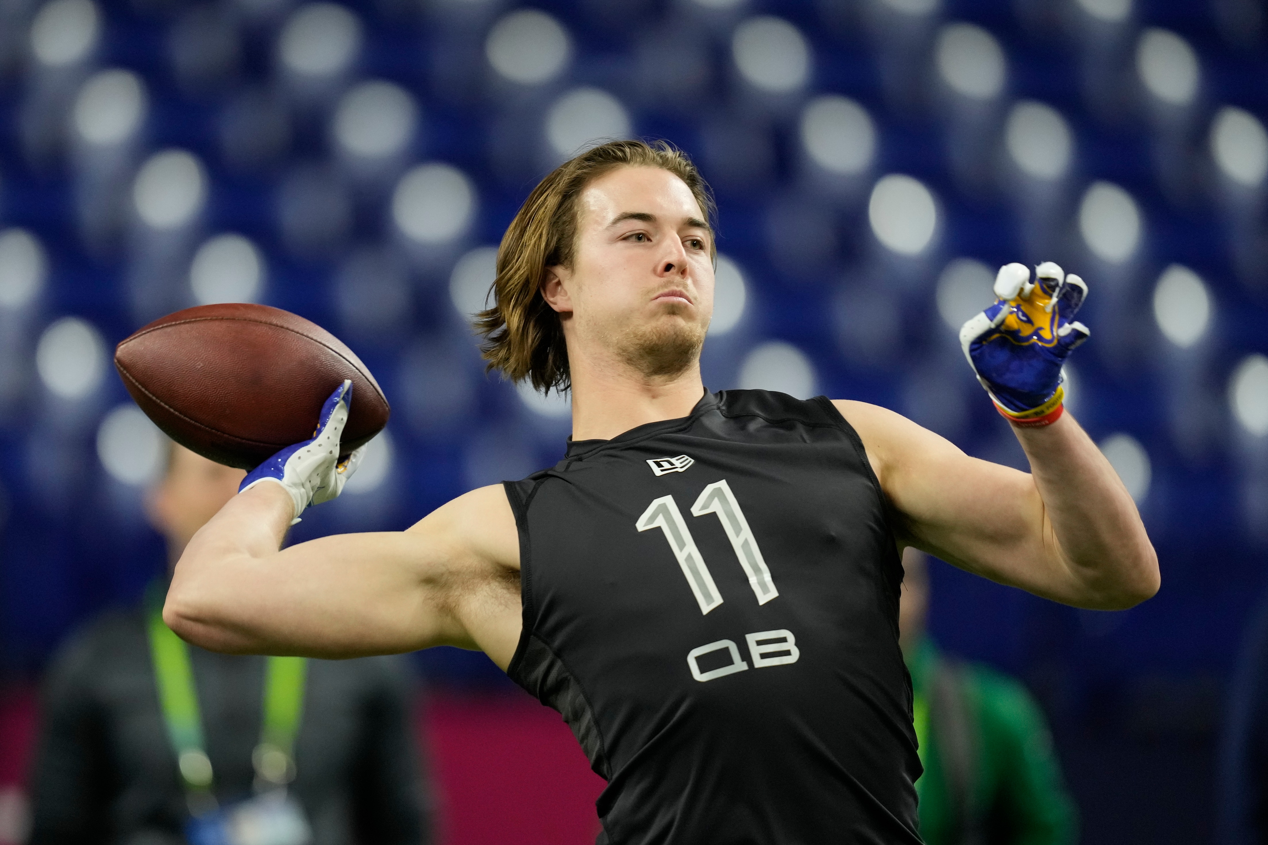 Pittsburgh quarterback Kenny Pickett throws a pass during a drill at the NFL football scouting combine, Thursday, March 3, 2022, in Indianapolis. (AP Photo/Charlie Neibergall)