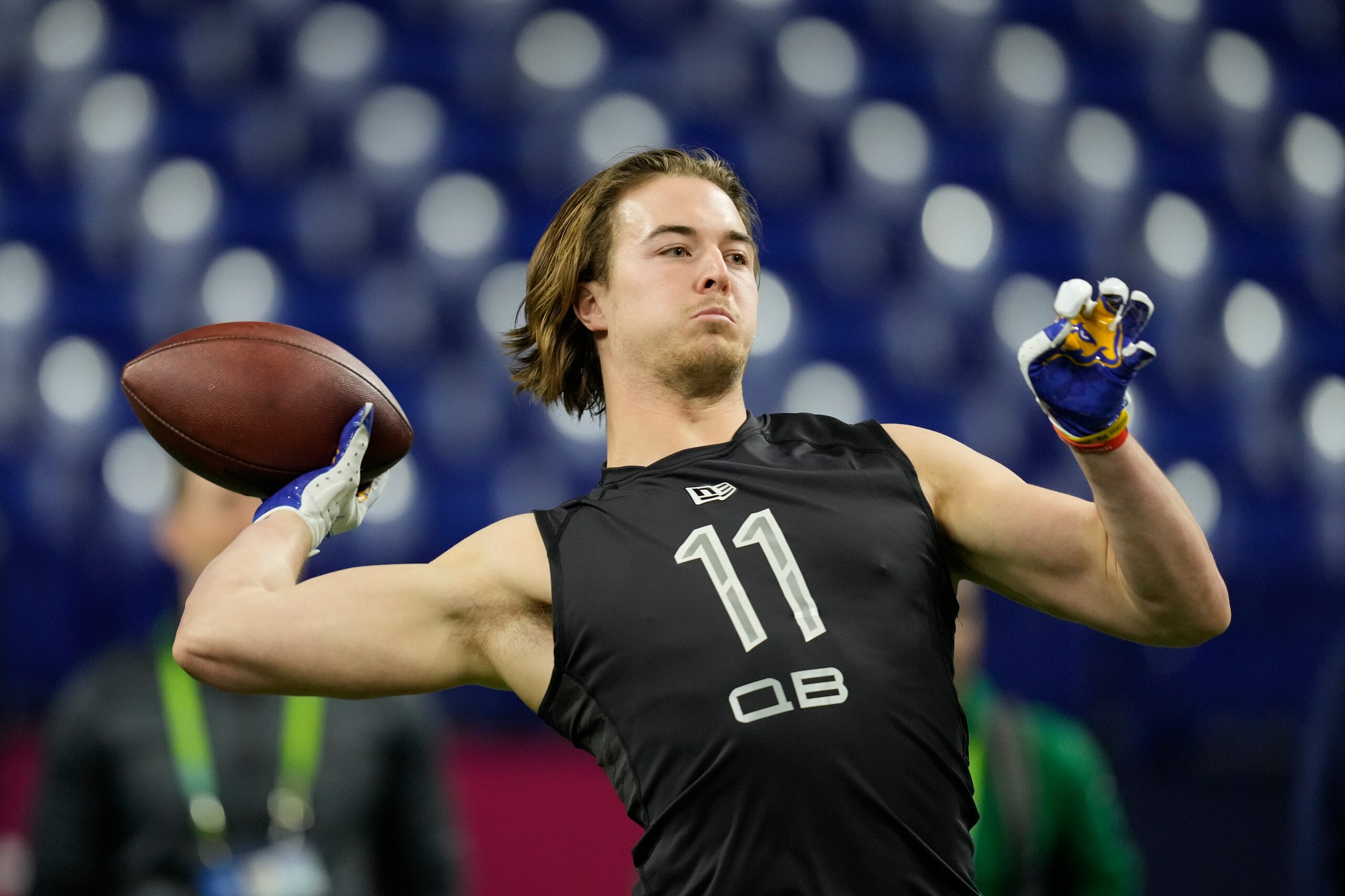 Pittsburgh quarterback Kenny Pickett throws a pass during a drill at the NFL football scouting combine, Thursday, March 3, 2022, in Indianapolis. (AP Photo/Charlie Neibergall)