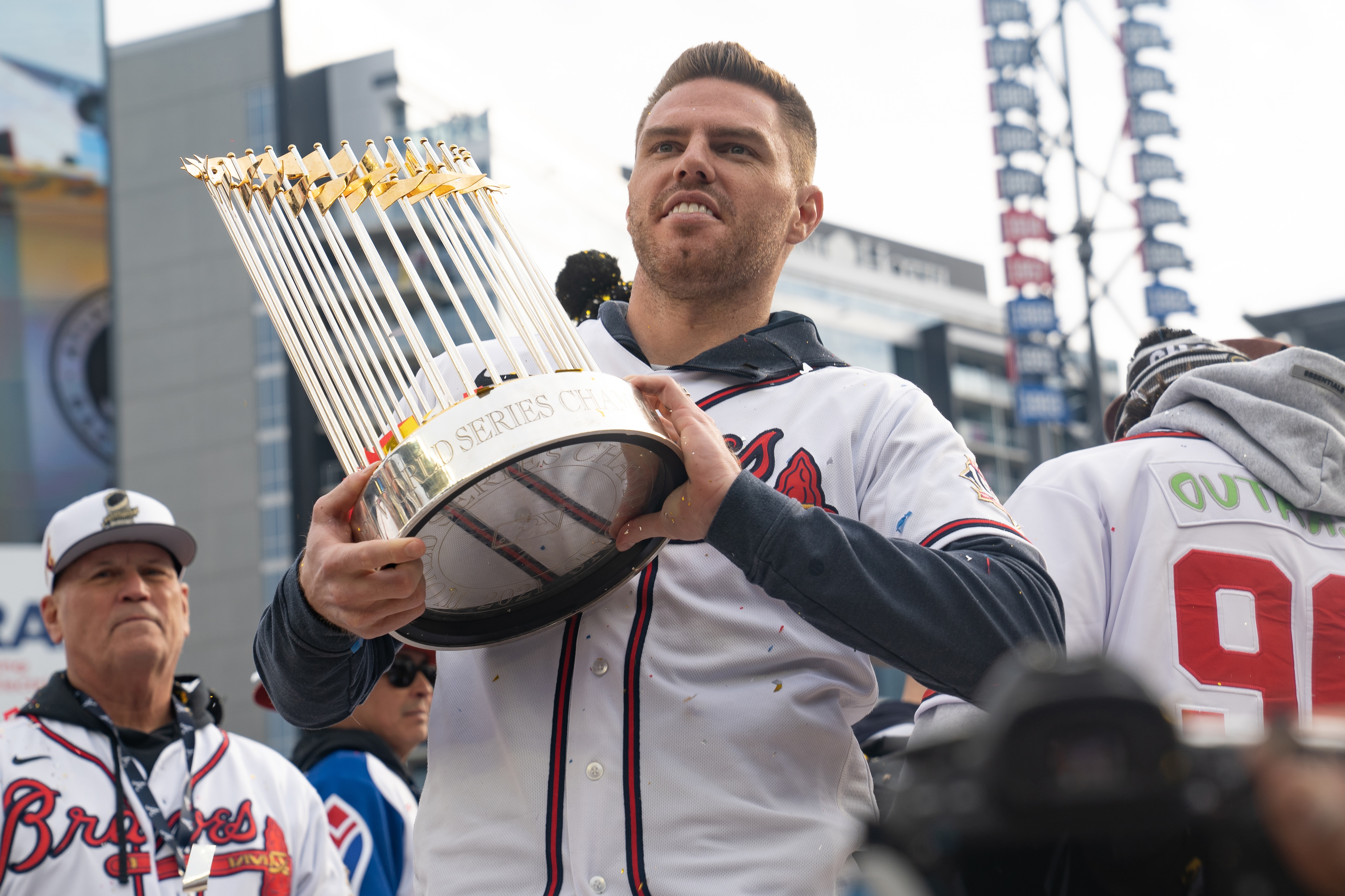 ATLANTA, GA - NOVEMBER 05: Freddie Freeman holds the Commissioner's Trophy as members of the Atlanta Braves celebrate following their World Series Parade at Truist Park on November 5, 2021 in Atlanta, Georgia. The Atlanta Braves won the World Series in six games against the Houston Astros winning their first championship since 1995. (Photo by Megan Varner/Getty Images) ATLANTA, GA - NOVEMBER 05: Freddie Freeman holds the Commissioner's Trophy as members of the Atlanta Braves celebrate following their World Series Parade at Truist Park on November 5, 2021 in Atlanta, Georgia. The Atlanta Braves won the World Series in six games against the Houston Astros winning their first championship since 1995. (Photo by Megan Varner/Getty Images)