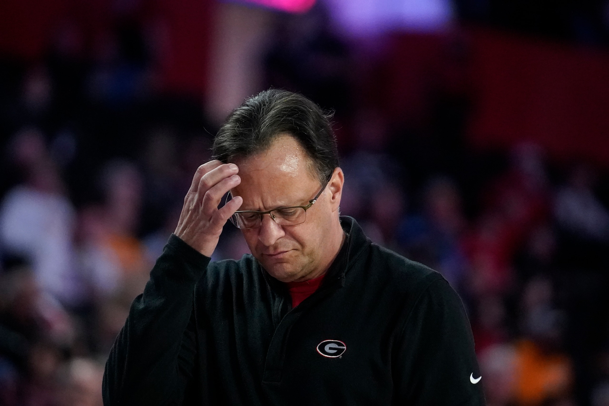 Georgia coach Tom Crean scratches his head during the first half of the team's NCAA college basketball game against Tennessee, Tuesday, March 1, 2022, in Athens, Ga. (AP Photo/Brynn Anderson)