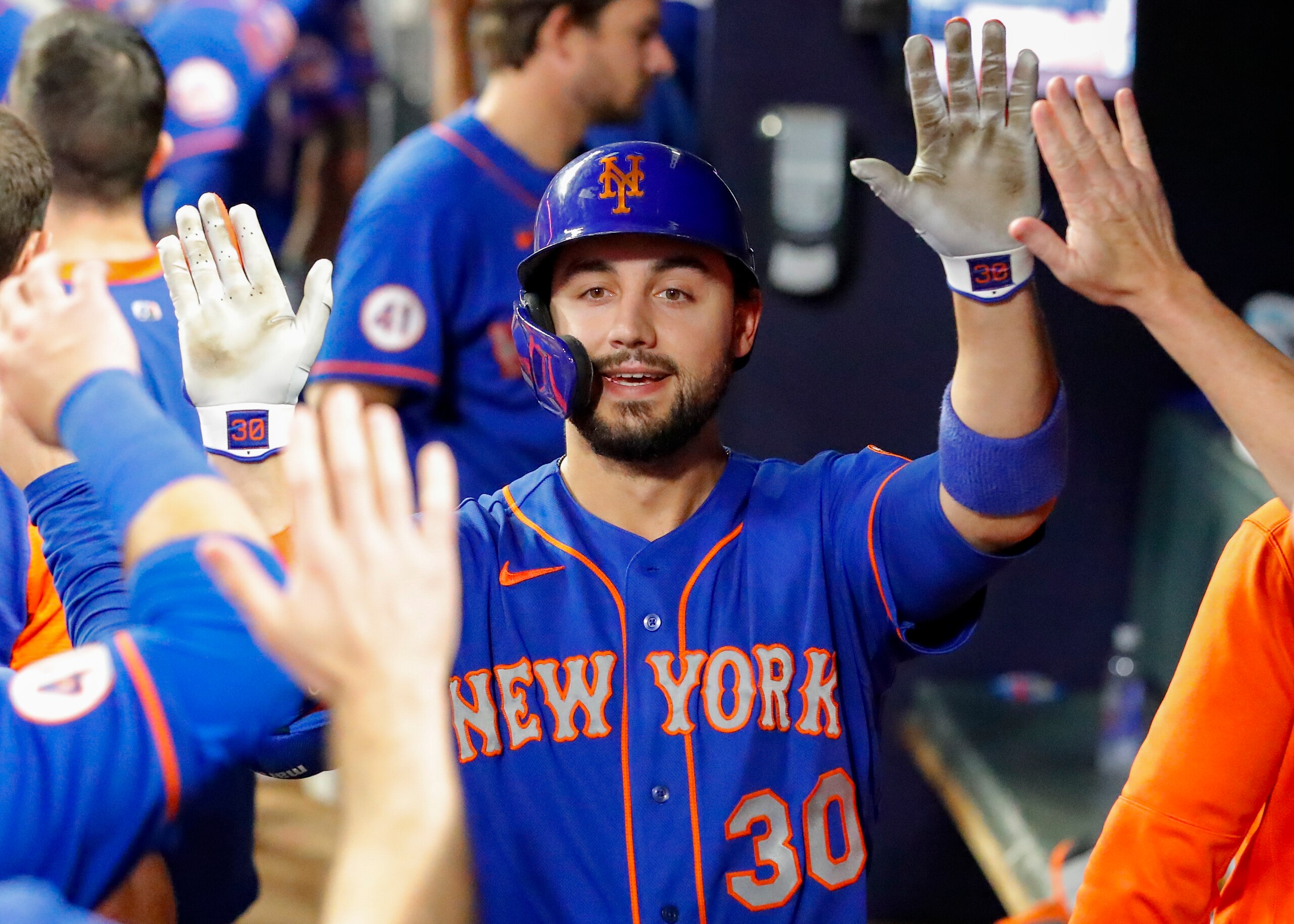 ATLANTA, GA - OCTOBER 02: Michael Conforto #30 of the New York Mets reacts with teammates after hitting a ball deep for a home run during the eighth inning of the game against the Atlanta Braves at Truist Park on October 2, 2021 in Atlanta, Georgia. (Photo by Todd Kirkland/Getty Images)