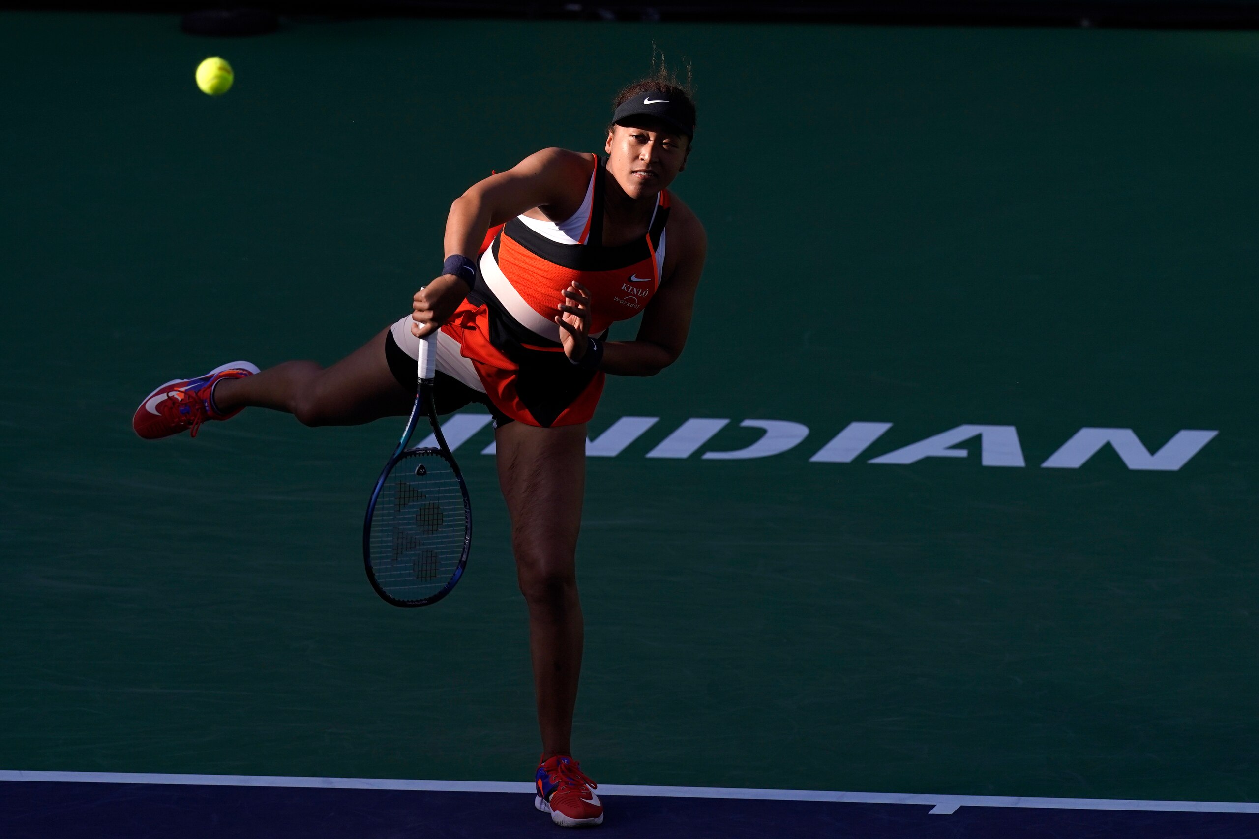 Naomi Osaka, of Japan, serves to Sloane Stephens at the BNP Paribas Open tennis tournament Thursday, March 10, 2022, in Indian Wells, Calif. (AP Photo/Mark J. Terrill)