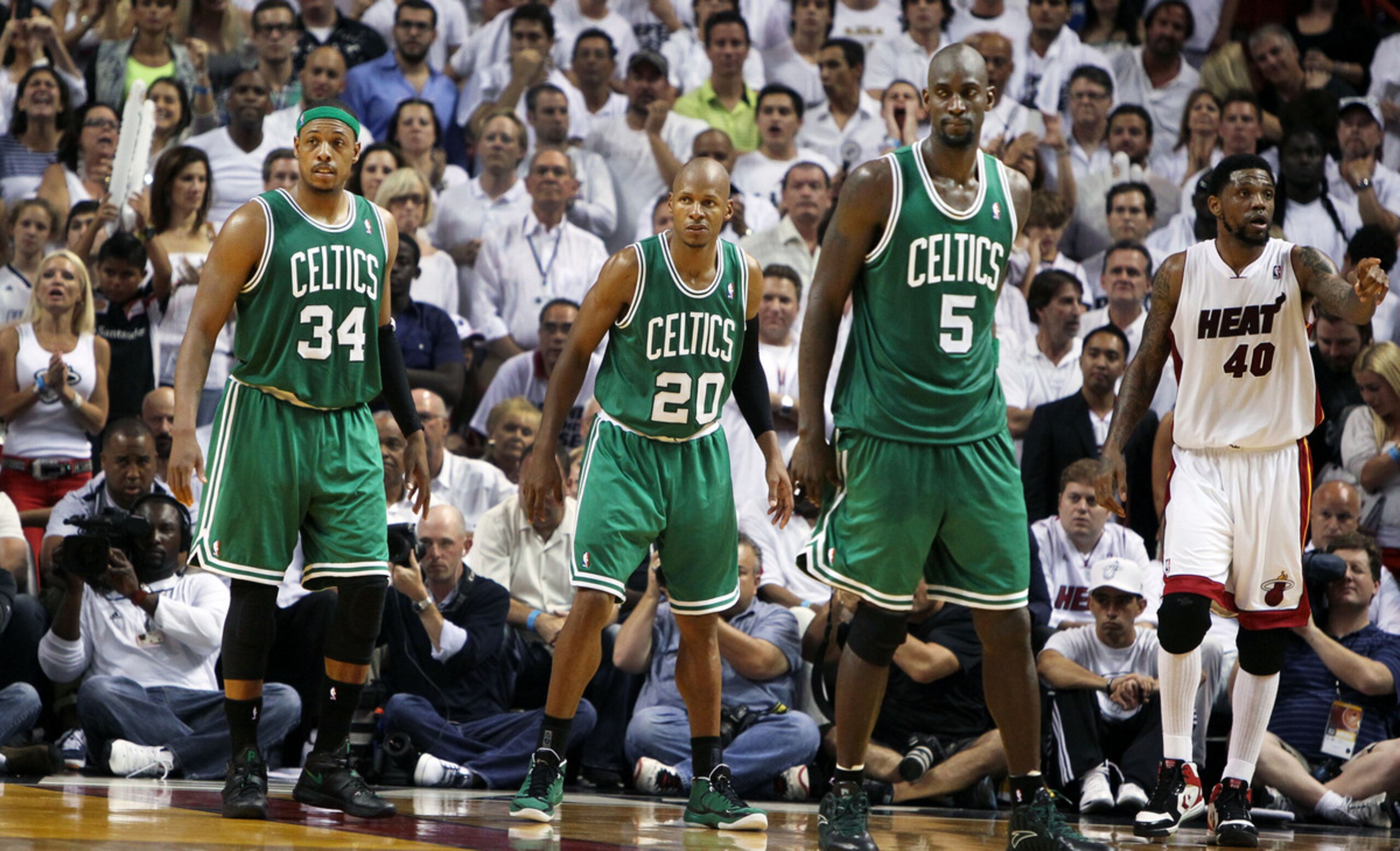 MIAMI - JUNE 9: The Celtics' Paul Pierce (#34), Ray Allen (#20), and Kevin Garnett (#5) are seen on the court near the end of the game and the series as the Boston Celtics visited the Miami Heat for Game Seven of the NBA Eastern Conference Finals at the American Airlines Arena. Miami's Udonis Haslem is in the background at far right. (Photo by Jim Davis/The Boston Globe via Getty Images)