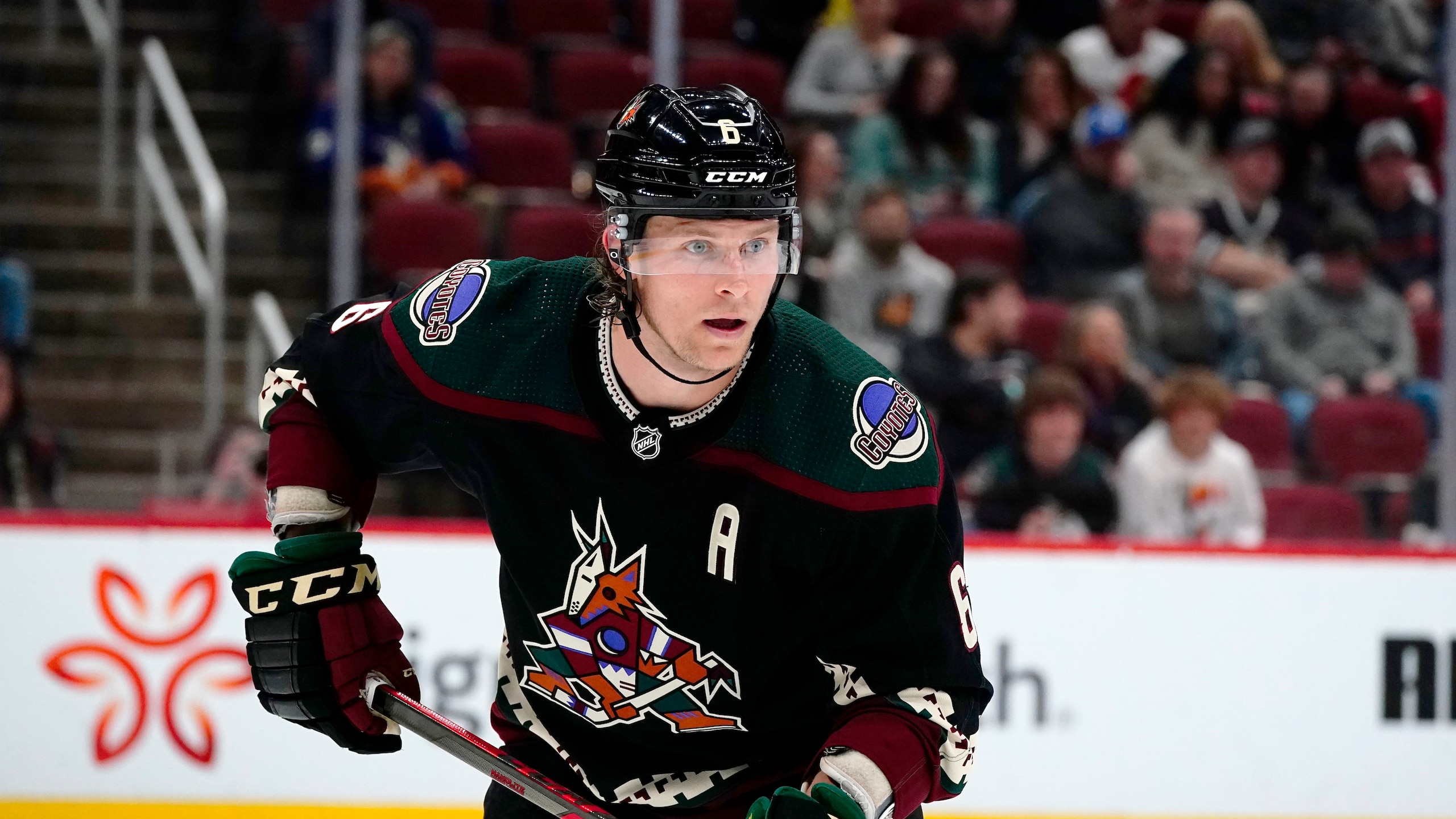 Arizona Coyotes defenseman Jakob Chychrun follows the puck during the second period of an NHL hockey game against the Ottawa Senators Saturday, March 5, 2022, in Glendale, Ariz. The Coyotes won 8-5. (AP Photo/Ross D. Franklin)