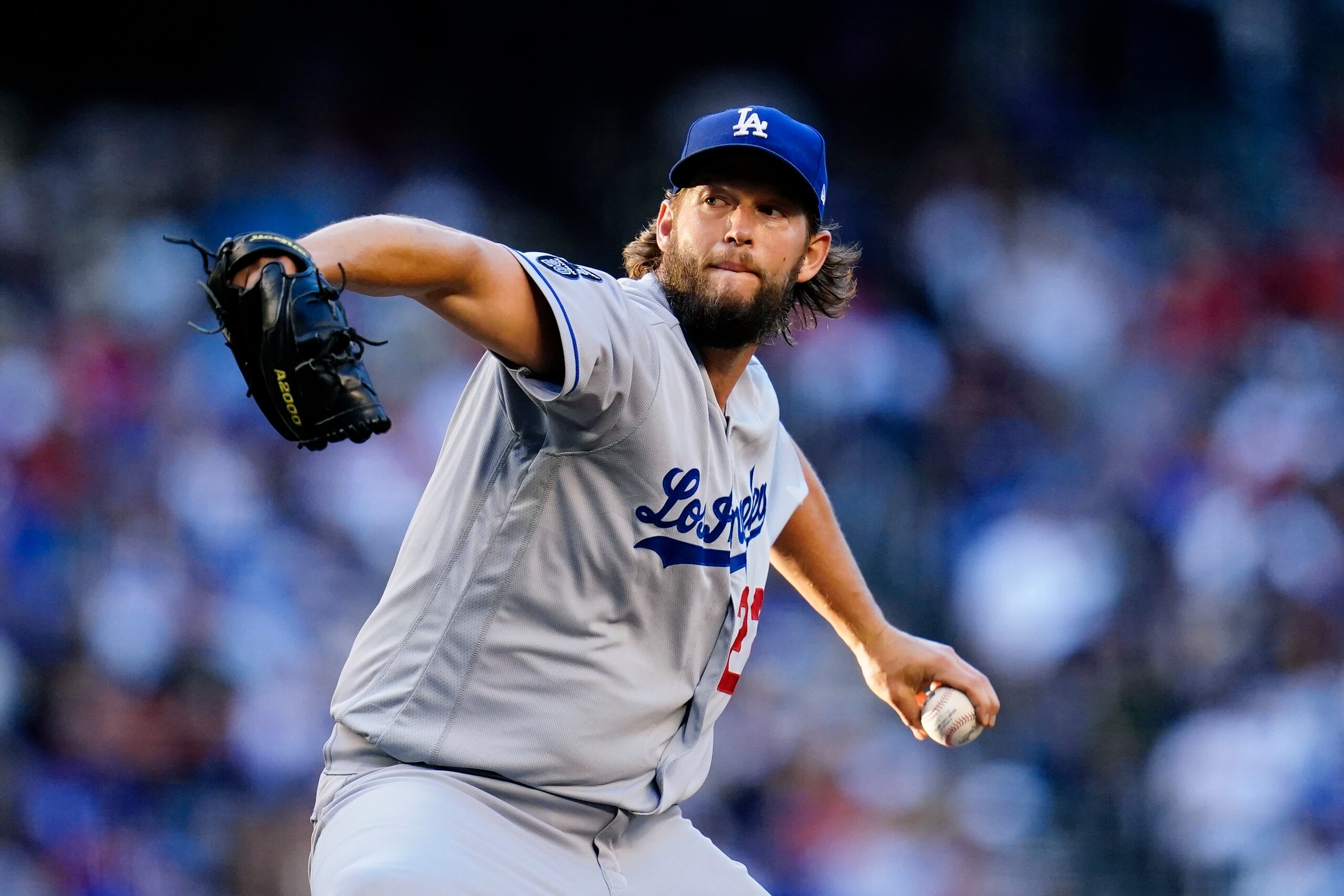 Los Angeles Dodgers starting pitcher Clayton Kershaw throws a pitch against the Arizona Diamondbacks during the second inning of a baseball game Saturday, Sept. 25, 2021, in Phoenix. (AP Photo/Ross D. Franklin)