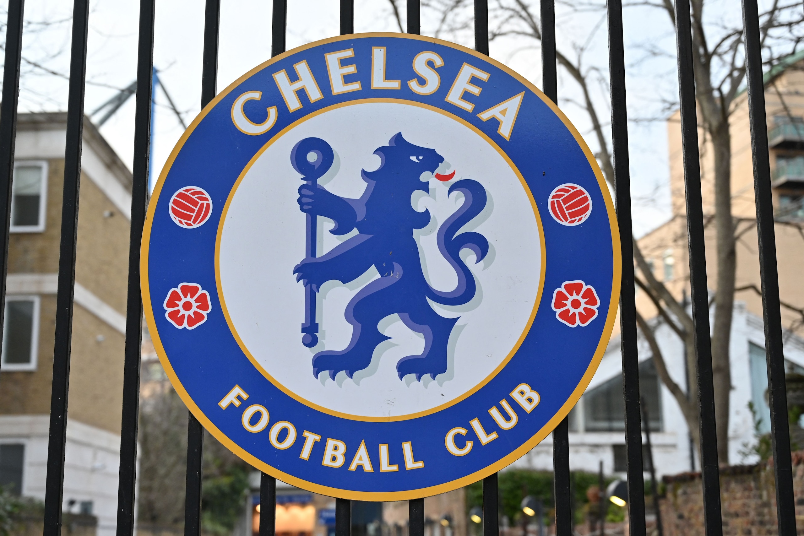 The Chelsea club crest is seen outside Chelsea's stadium, Stamford Bridge in London on March 10, 2022, as Chelsea's Russian owner Roman Abramovich was  hit with a UK assets freeze and travel ban, throwing his plans to sell the European and world club champions into disarray. - Chelsea shirt sponsor Three announced Thursday it was suspending its deal with the Premier League club after the UK government slapped sanctions on Russian owner Roman Abramovich. (Photo by JUSTIN TALLIS / AFP) (Photo by JUSTIN TALLIS/AFP via Getty Images)