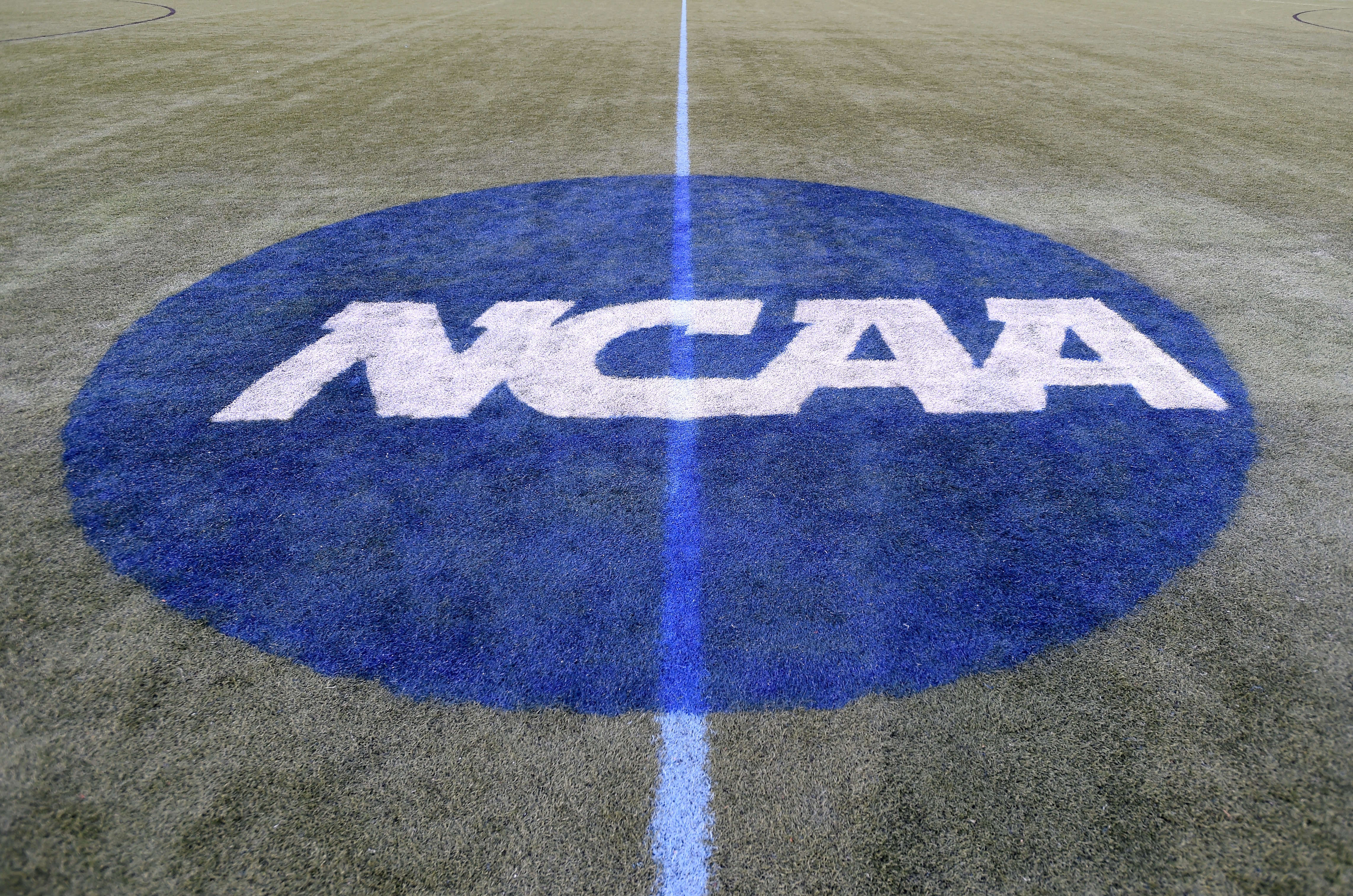 BALTIMORE, MD - MAY 24:  The NCAA logo on the field at Homewood Field duirng the Semifinals of the 2019 NCAA Division I Women's Lacrosse Championship on May 24, 2019 in Baltimore, Maryland.  (Photo by G Fiume/Getty Images)