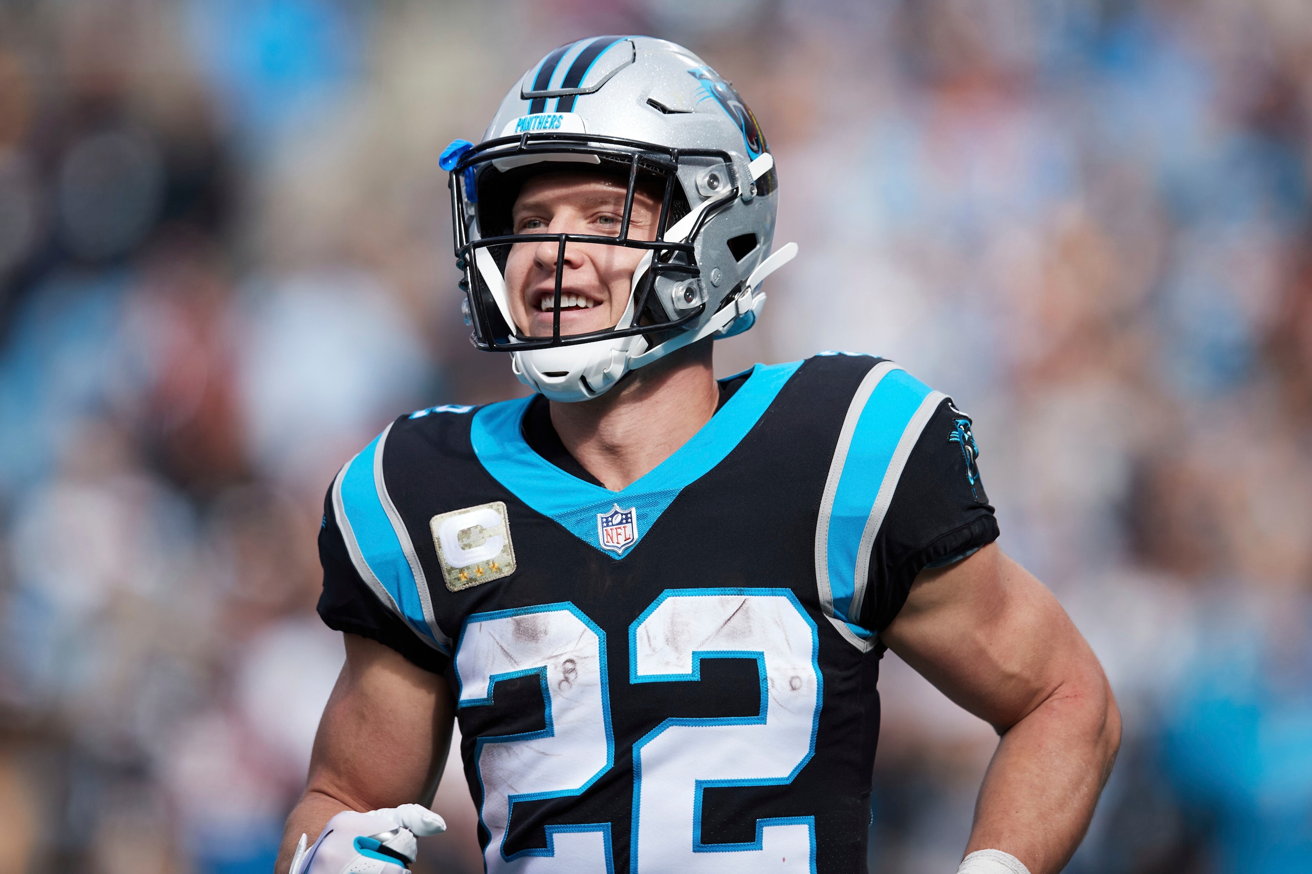 Carolina Panthers running back Christian McCaffrey (22) smiles after a touchdown during an NFL football game against the Washington Football Team, Sunday, Nov. 21, 2021, in Charlotte, N.C. (AP Photo/Brian Westerholt) Carolina Panthers running back Christian McCaffrey (22) smiles after a touchdown during an NFL football game against the Washington Football Team, Sunday, Nov. 21, 2021, in Charlotte, N.C. (AP Photo/Brian Westerholt)
