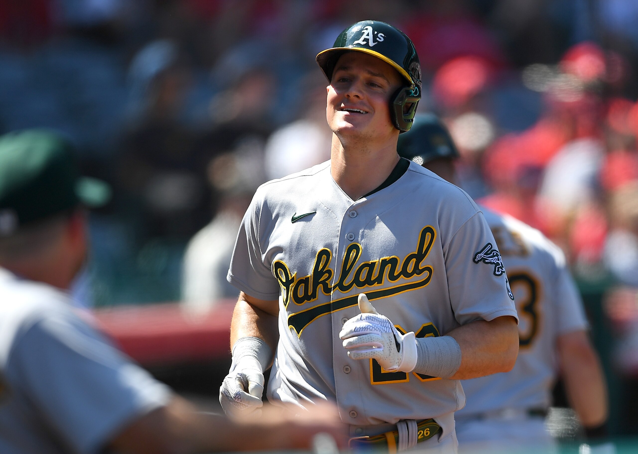ANAHEIM, CA - SEPTEMBER 19: Matt Chapman #26 of the Oakland Athletics is greeted in the dugout after hitting a solo home run in the fourth inning of the game against the Los Angeles Angels at Angel Stadium of Anaheim on September 19, 2021 in Anaheim, California. (Photo by Jayne Kamin-Oncea/Getty Images)