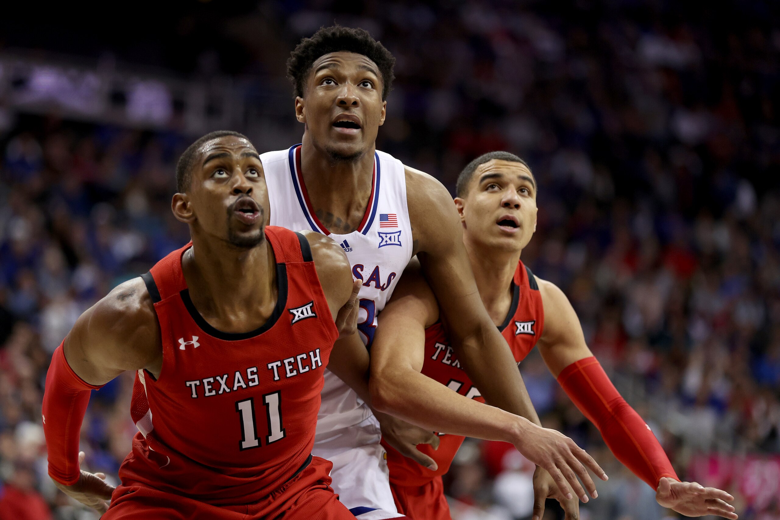 KANSAS CITY, MISSOURI - MARCH 12: David McCormack #33 of the Kansas Jayhawks competes for a rebound in the first half against the Texas Tech Red Raiders during the finals of the 2022 Phillips 66 Big 12 Men's Basketball Championship at T-Mobile Center on March 12, 2022 in Kansas City, Missouri. (Photo by Jamie Squire/Getty Images)
