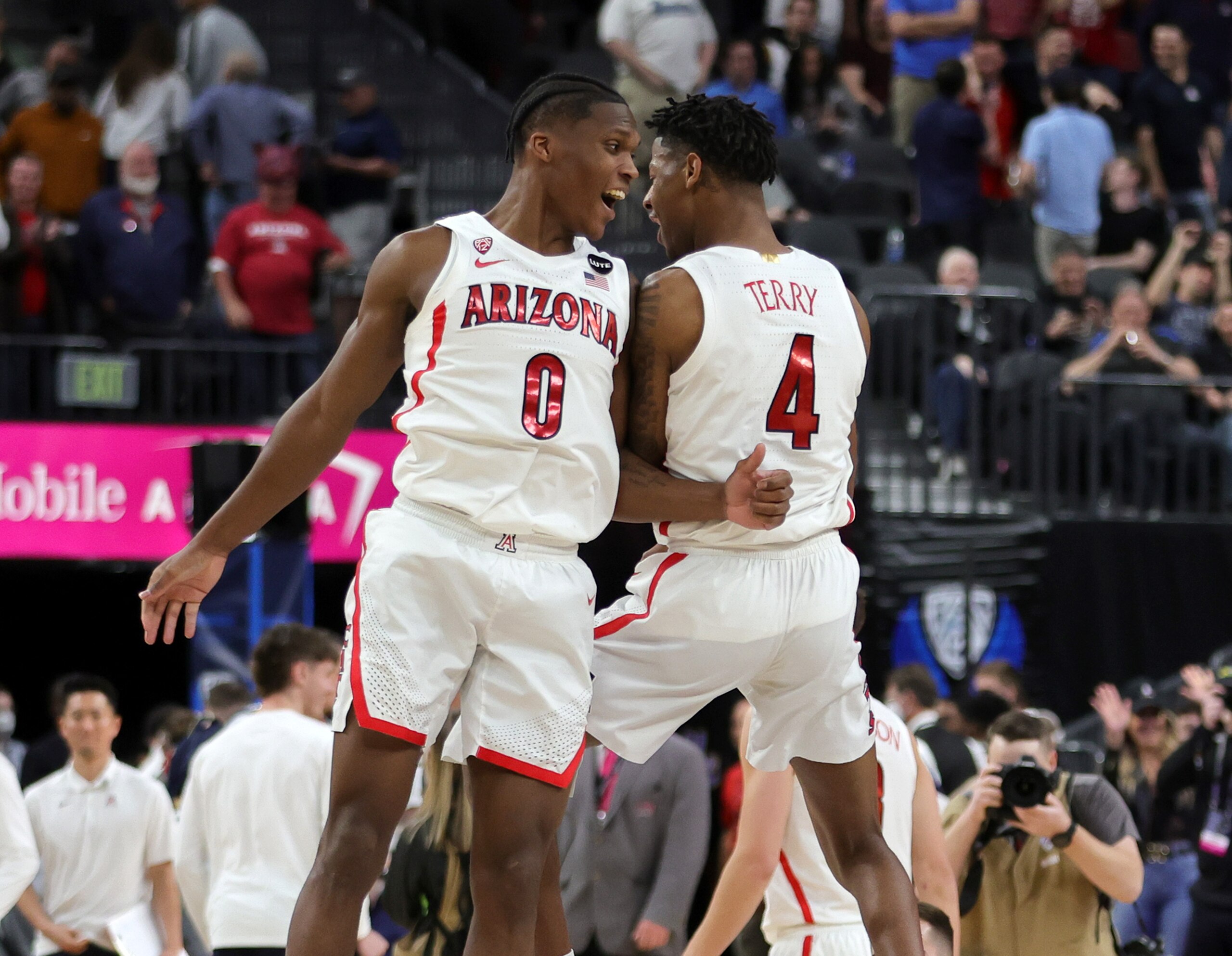 LAS VEGAS, NEVADA - MARCH 11: Bennedict Mathurin #0 and Dalen Terry #4 of the Arizona Wildcats celebrate on the court after the team's 82-72 victory over the Colorado Buffaloes during the Pac-12 Conference basketball tournament semifinals at T-Mobile Arena on March 11, 2022 in Las Vegas, Nevada. (Photo by Ethan Miller/Getty Images)