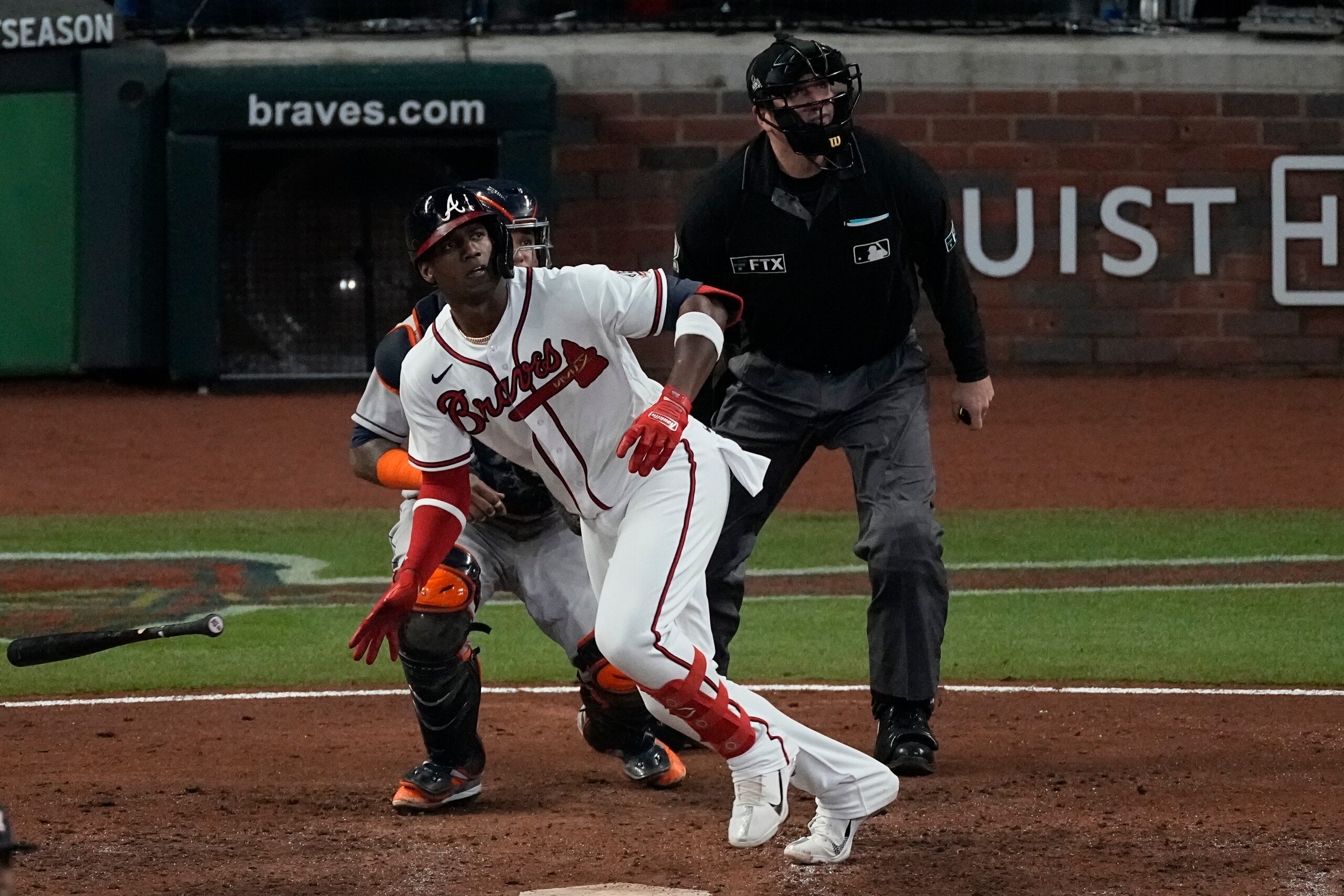 Atlanta Braves' Jorge Soler watches his home run during the seventh inning in Game 4 of baseball's World Series between the Houston Astros and the Atlanta Braves Saturday, Oct. 30, 2021, in Atlanta.(AP Photo/John Bazemore)