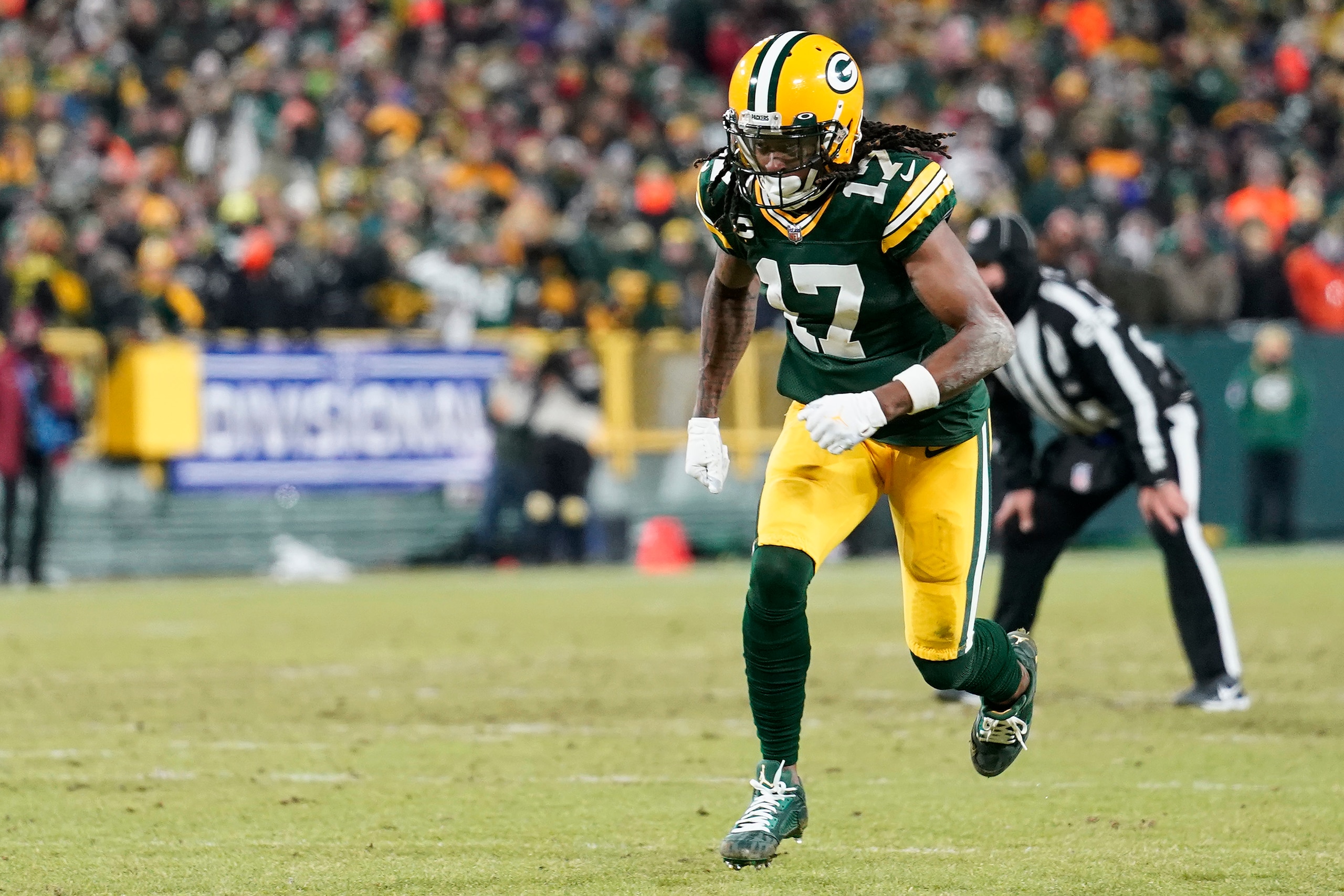 GREEN BAY, WISCONSIN - JANUARY 22:  Wide receiver Davante Adams #17 of the Green Bay Packers in action during the NFC Divisional Playoff game against the San Francisco 49ers at Lambeau Field on January 22, 2022 in Green Bay, Wisconsin. (Photo by Patrick McDermott/Getty Images)
