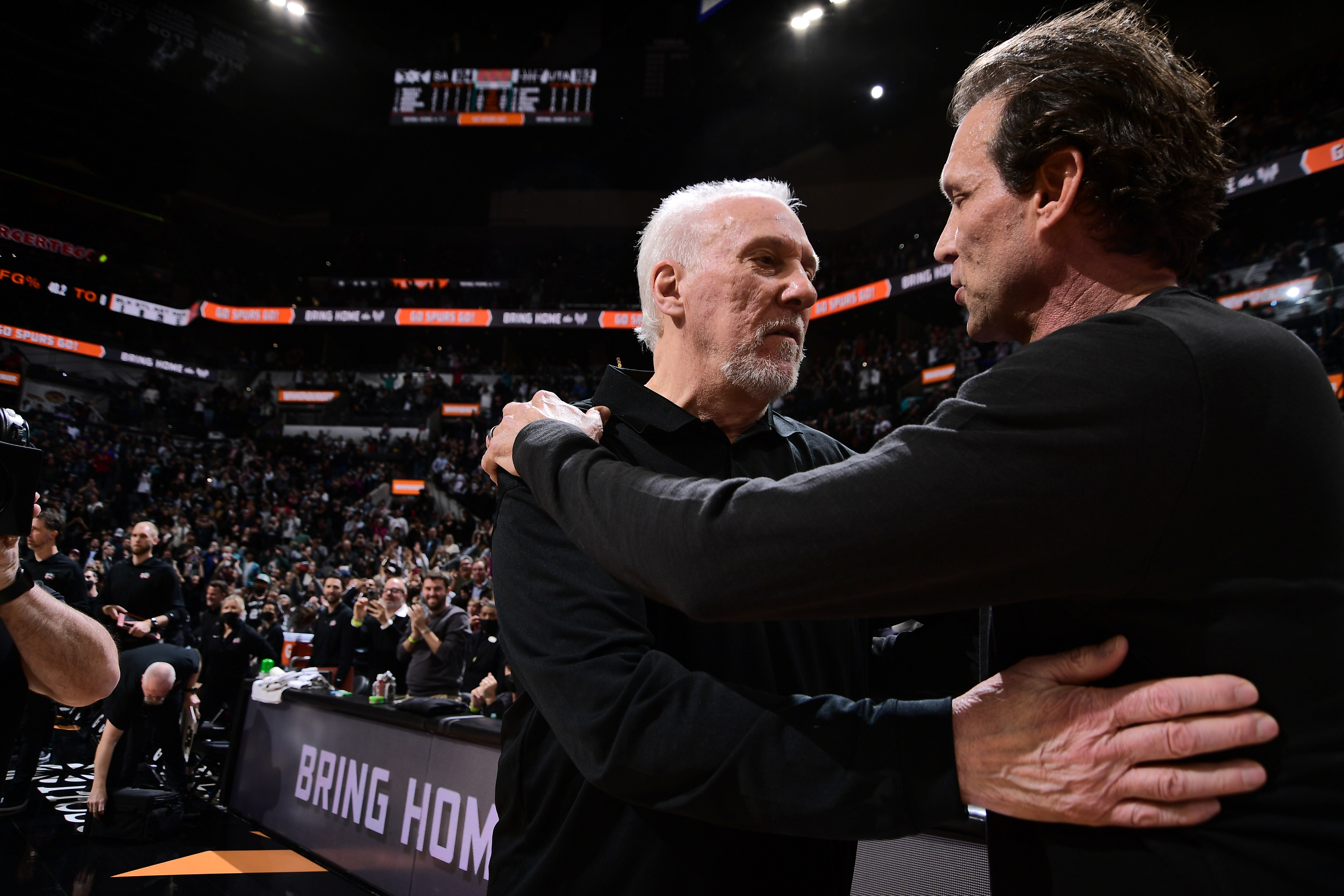 SAN ANTONIO, TX - MARCH 11: Head Coach Quin Snyder of the Utah Jazz congratulates Head Coach Gregg Popovich for winning his 1,336th game to become the winningest coach in NBA history on March 11, 2022 at the AT&T Center in San Antonio, Texas. NOTE TO USER: User expressly acknowledges and agrees that, by downloading and or using this photograph, user is consenting to the terms and conditions of the Getty Images License Agreement. Mandatory Copyright Notice: Copyright 2022 NBAE (Photos by Michael Gonzales/NBAE via Getty Images)