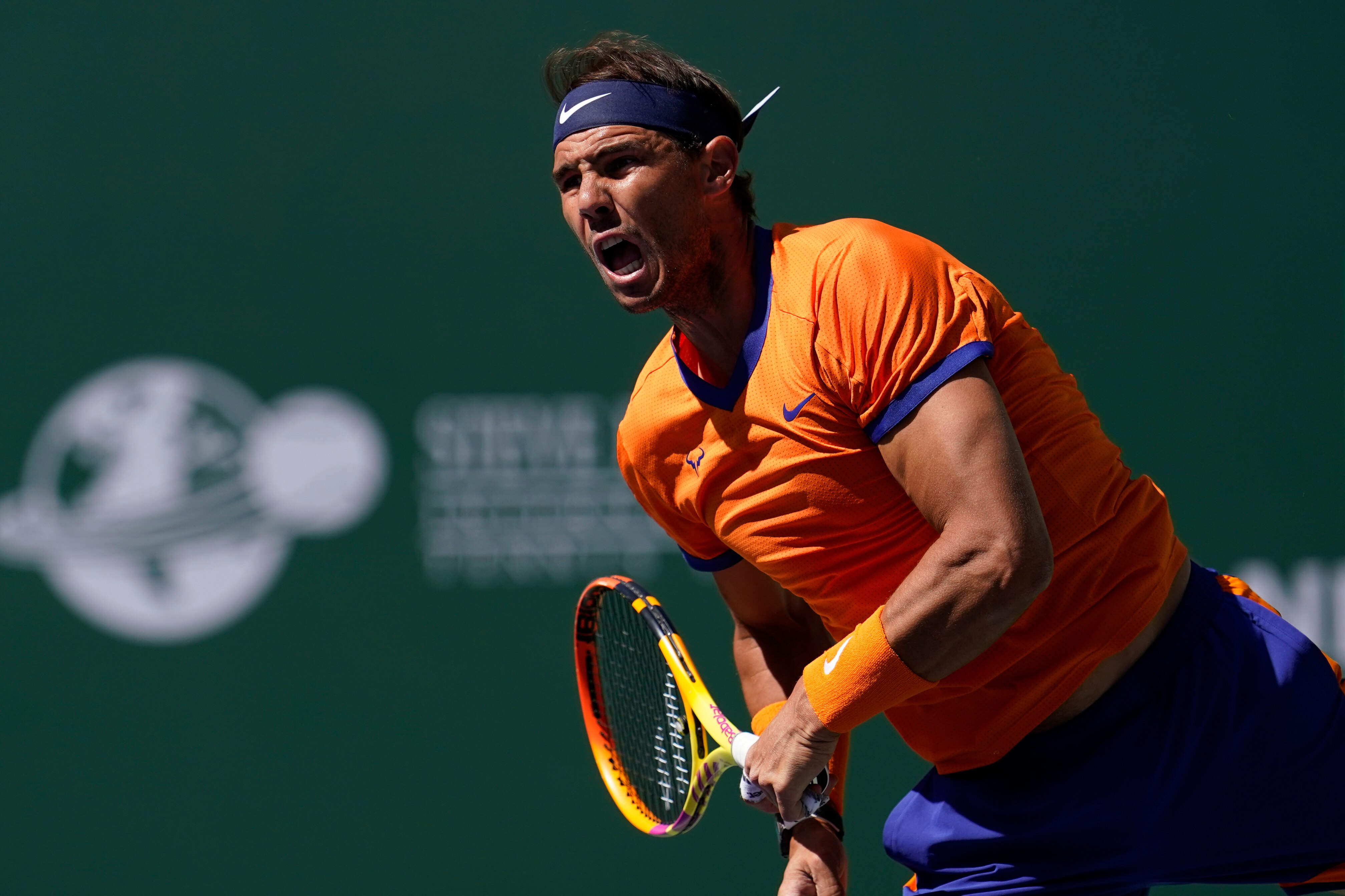 Rafael Nadal, of Spain, serves to Daniel Evans, of Britain, at the BNP Paribas Open tennis tournament Monday, March 14, 2022, in Indian Wells, Calif. (AP Photo/Marcio Jose Sanchez)