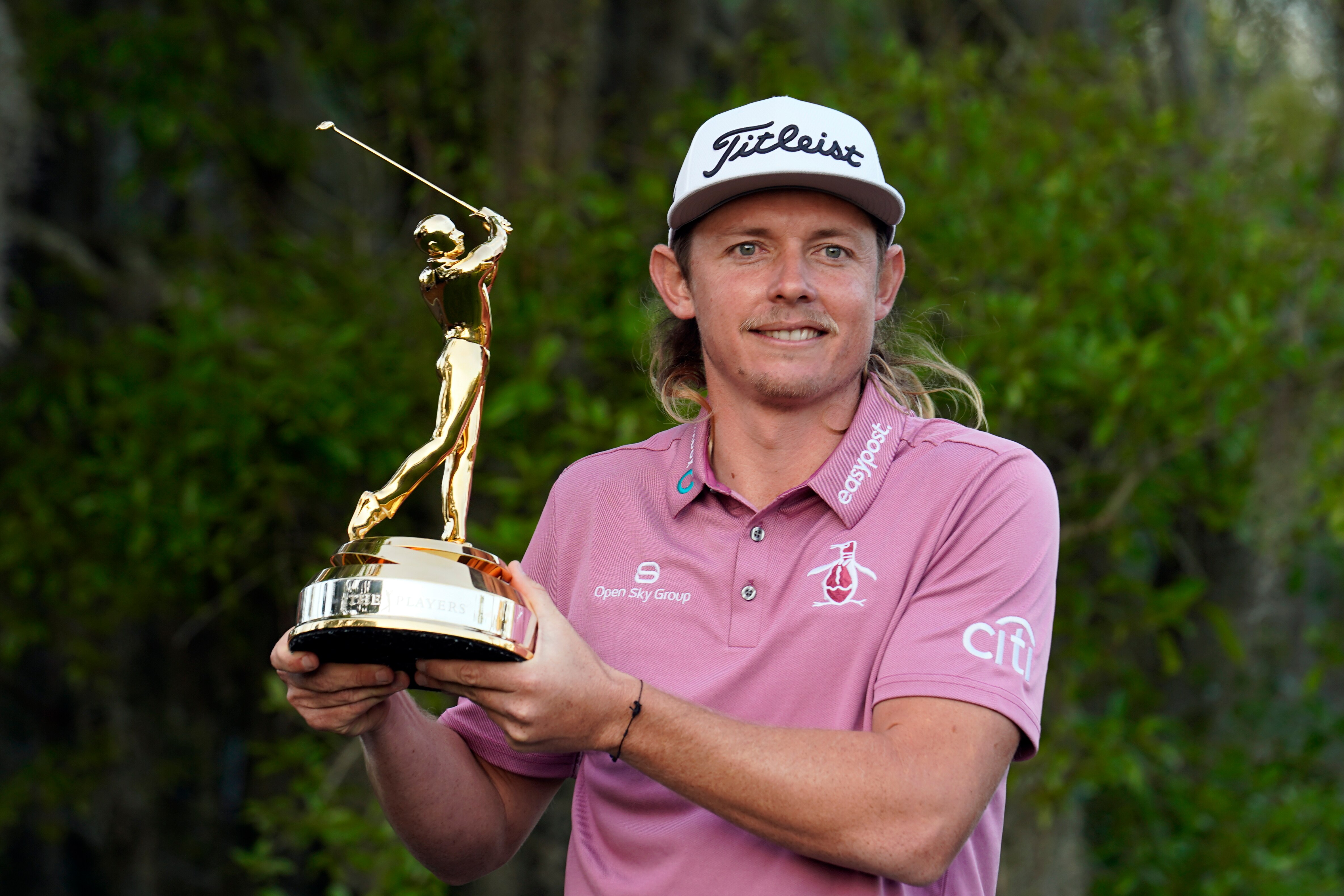Cameron Smith, of Australia, holds the trophy after winning The Players Championship golf tournament Monday, March 14, 2022, in Ponte Vedra Beach, Fla. (AP Photo/Gerald Herbert)