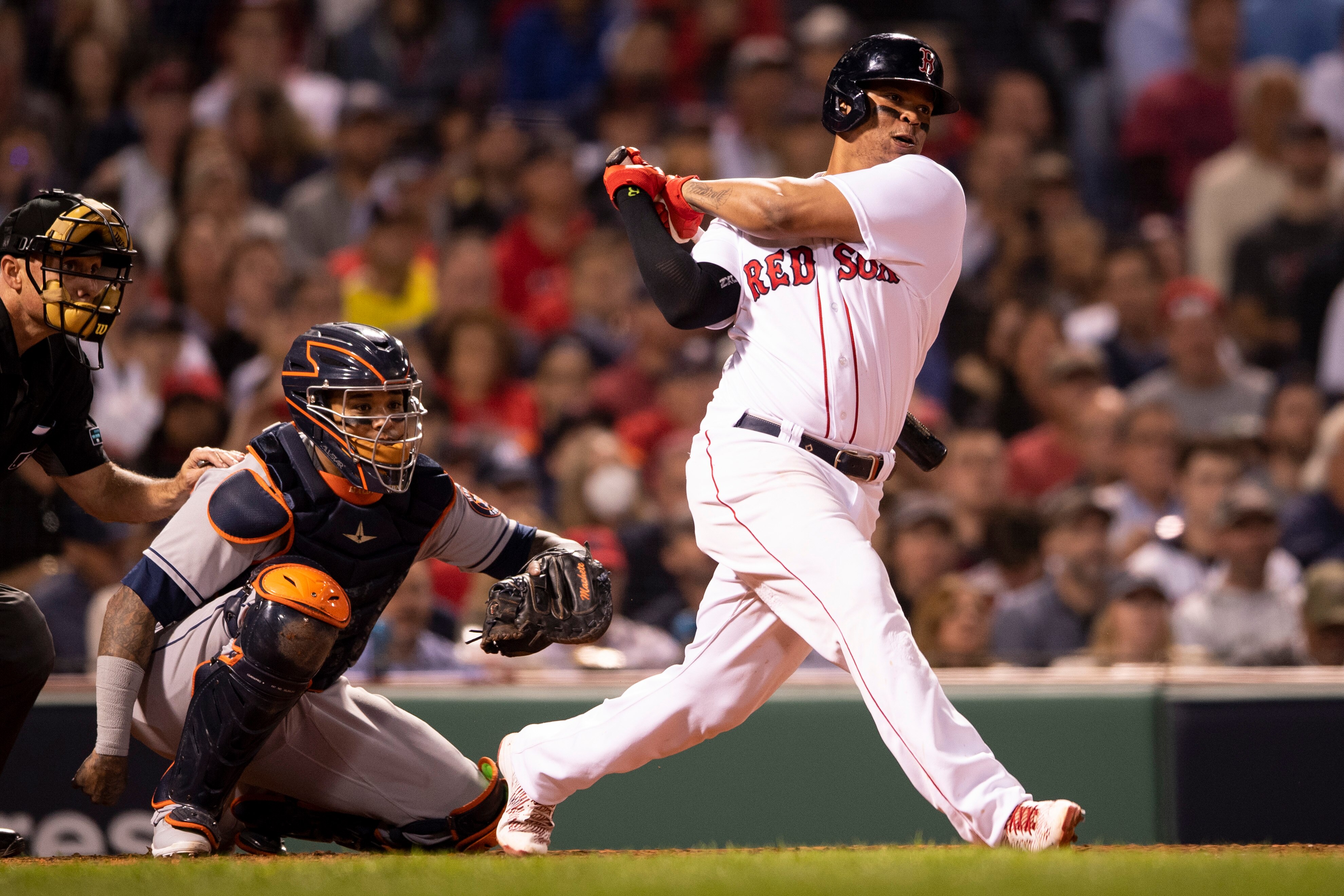 BOSTON, MA - OCTOBER 20: Rafael Devers #11 of the Boston Red Sox hits a single during the fifth inning of game five of the 2021 American League Championship Series against the Houston Astros at Fenway Park on October 20, 2021 in Boston, Massachusetts. (Photo by Billie Weiss/Boston Red Sox/Getty Images)