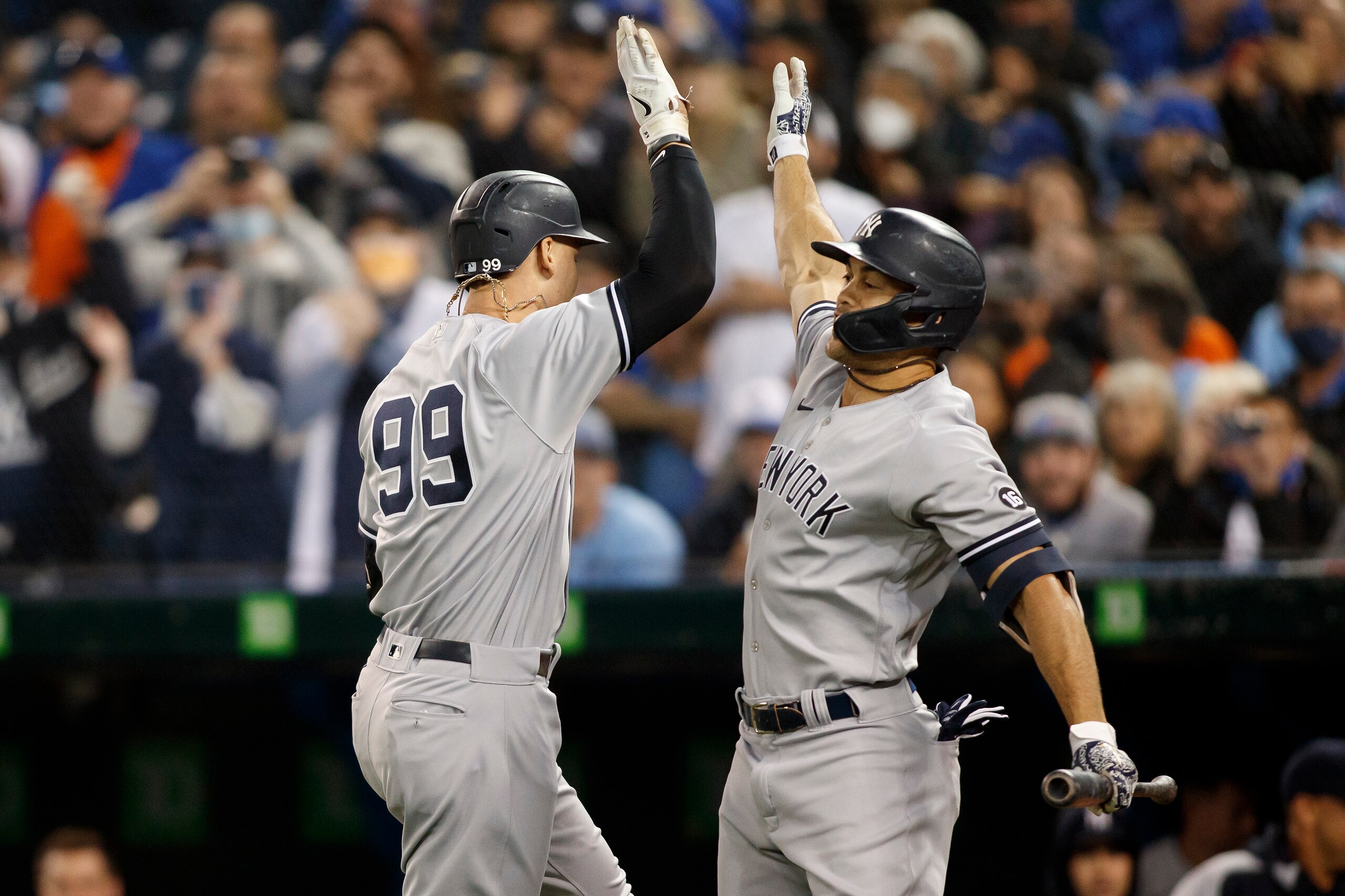 TORONTO, ON - SEPTEMBER 30: Aaron Judge #99 celebrates his solo home run with Giancarlo Stanton #27 of the New York Yankees in the first inning of their MLB game against the Toronto Blue Jays at Rogers Centre on September 30, 2021 in Toronto, Ontario. (Photo by Cole Burston/Getty Images)