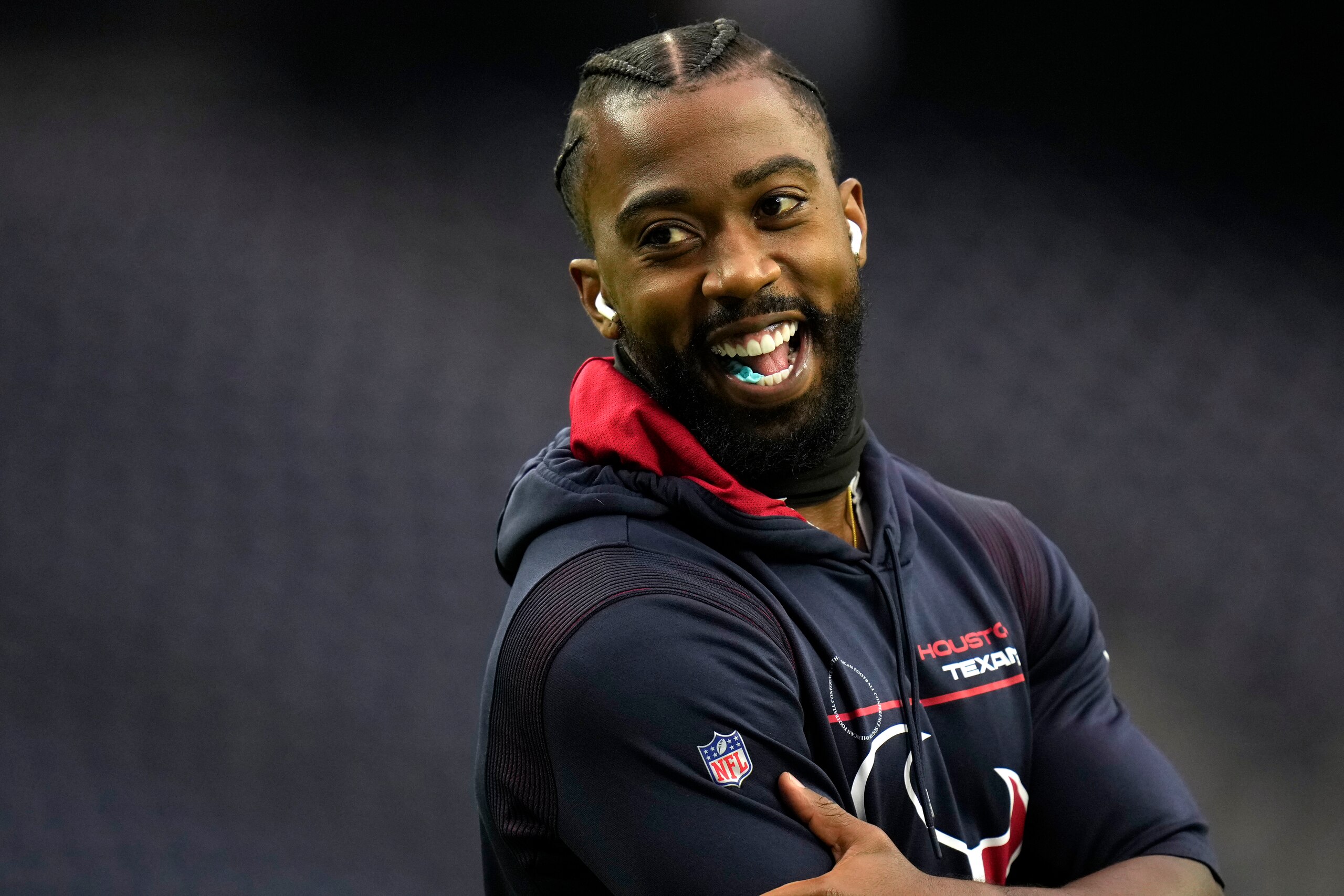 Houston Texans quarterback Tyrod Taylor laughs before an NFL football game against the Los Angeles Chargers Sunday, Dec. 26, 2021, in Houston. (AP Photo/Eric Christian Smith)