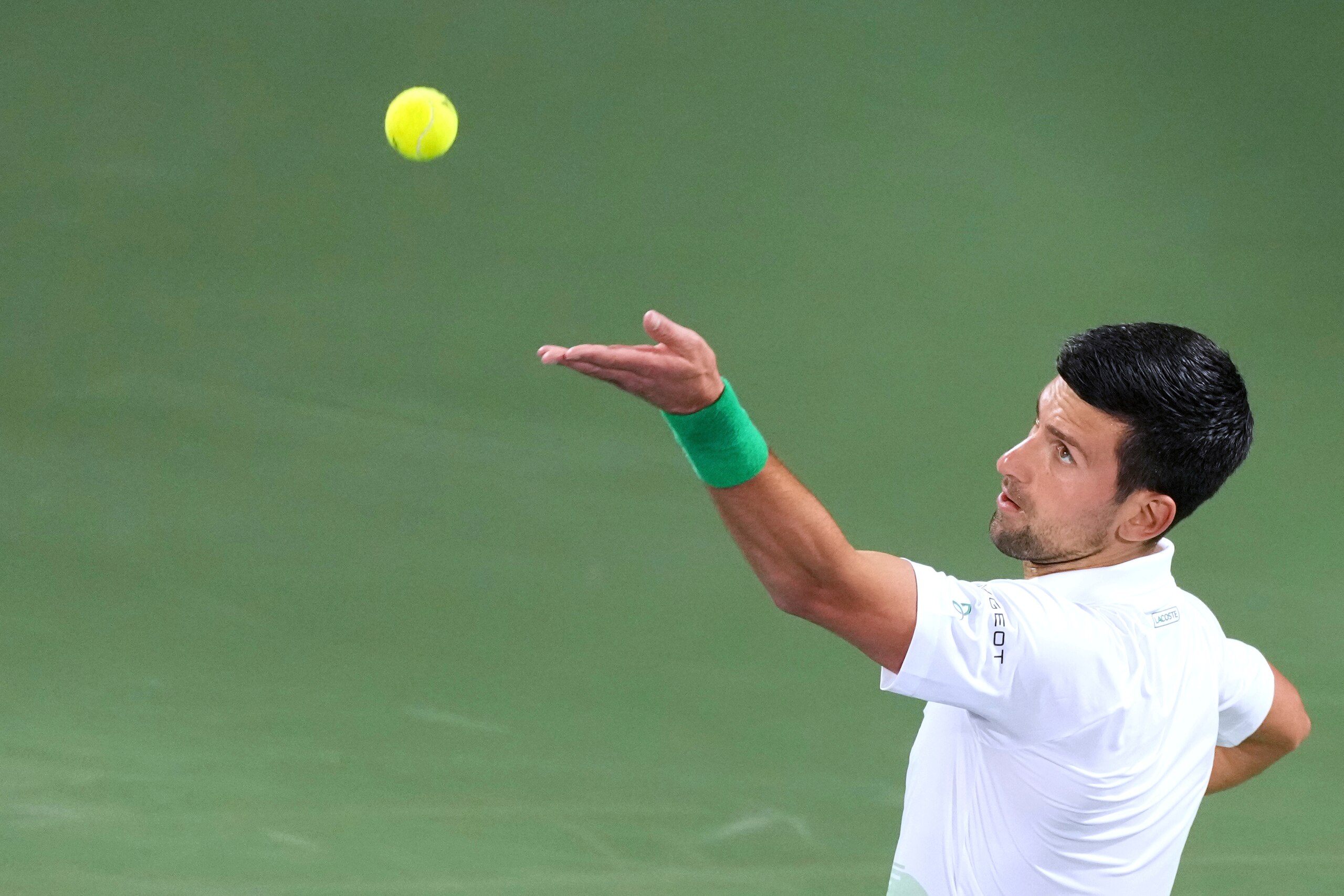 Serbia's Novak Djokovic serves to Russia's Karen Khachanov during a match at the Dubai Duty Free Tennis Championship in Dubai, United Arab Emirates, Wednesday, Feb. 23, 2022. (AP Photo/Ebrahim Noroozi)
