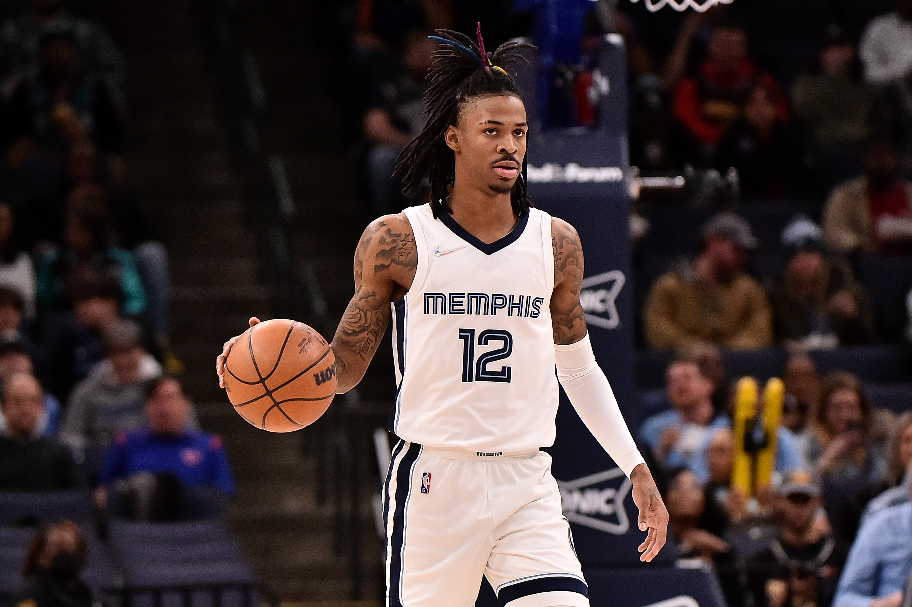 MEMPHIS, TENNESSEE - MARCH 11: Ja Morant #12 of the Memphis Grizzlies brings the ball up court during the game against the New York Knicks at FedExForum on March 11, 2022 in Memphis, Tennessee. NOTE TO USER: User expressly acknowledges and agrees that , by downloading and or using this photograph, User is consenting to the terms and conditions of the Getty Images License Agreement.  (Photo by Justin Ford/Getty Images)