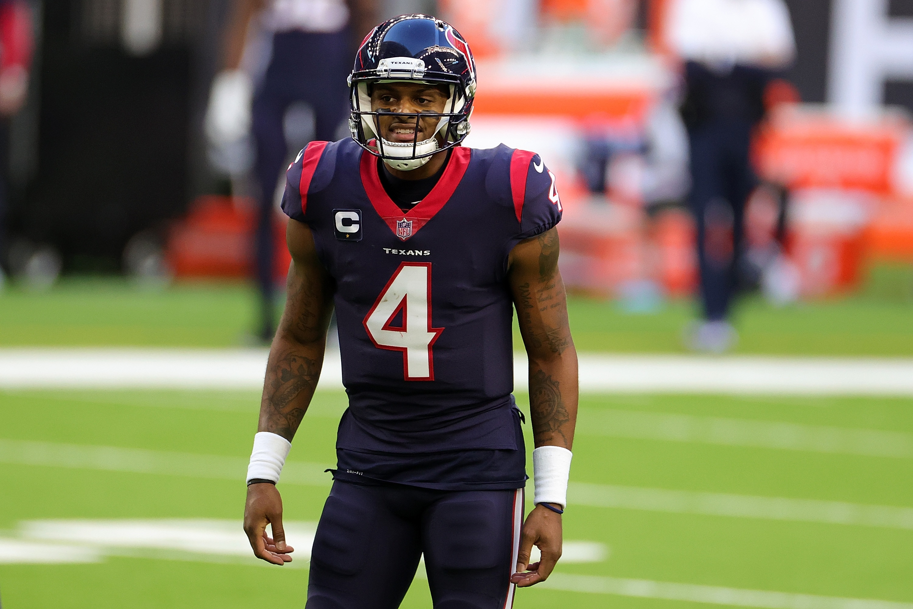 HOUSTON, TEXAS - JANUARY 03: Deshaun Watson #4 of the Houston Texans reacts to a play during the first half against the Tennessee Titans at NRG Stadium on January 03, 2021 in Houston, Texas. (Photo by Carmen Mandato/Getty Images)