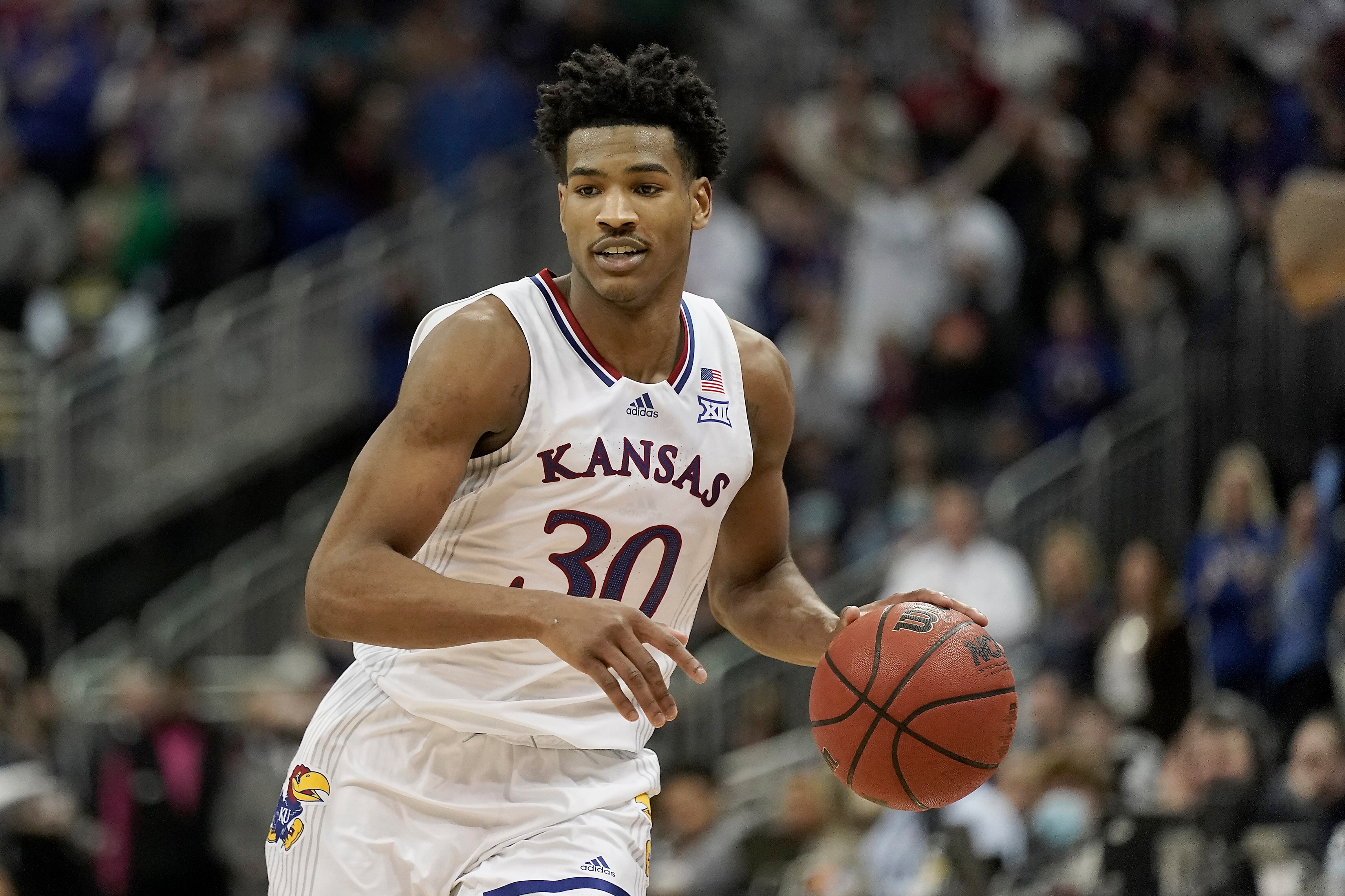 Kansas guard Ochai Agbaji drives during the second half of an NCAA college basketball championship game against Texas Tech in the Big 12 Conference tournament in Kansas City, Mo., Saturday, March 12, 2022. Kansas won 74-65. (AP Photo/Charlie Riedel)