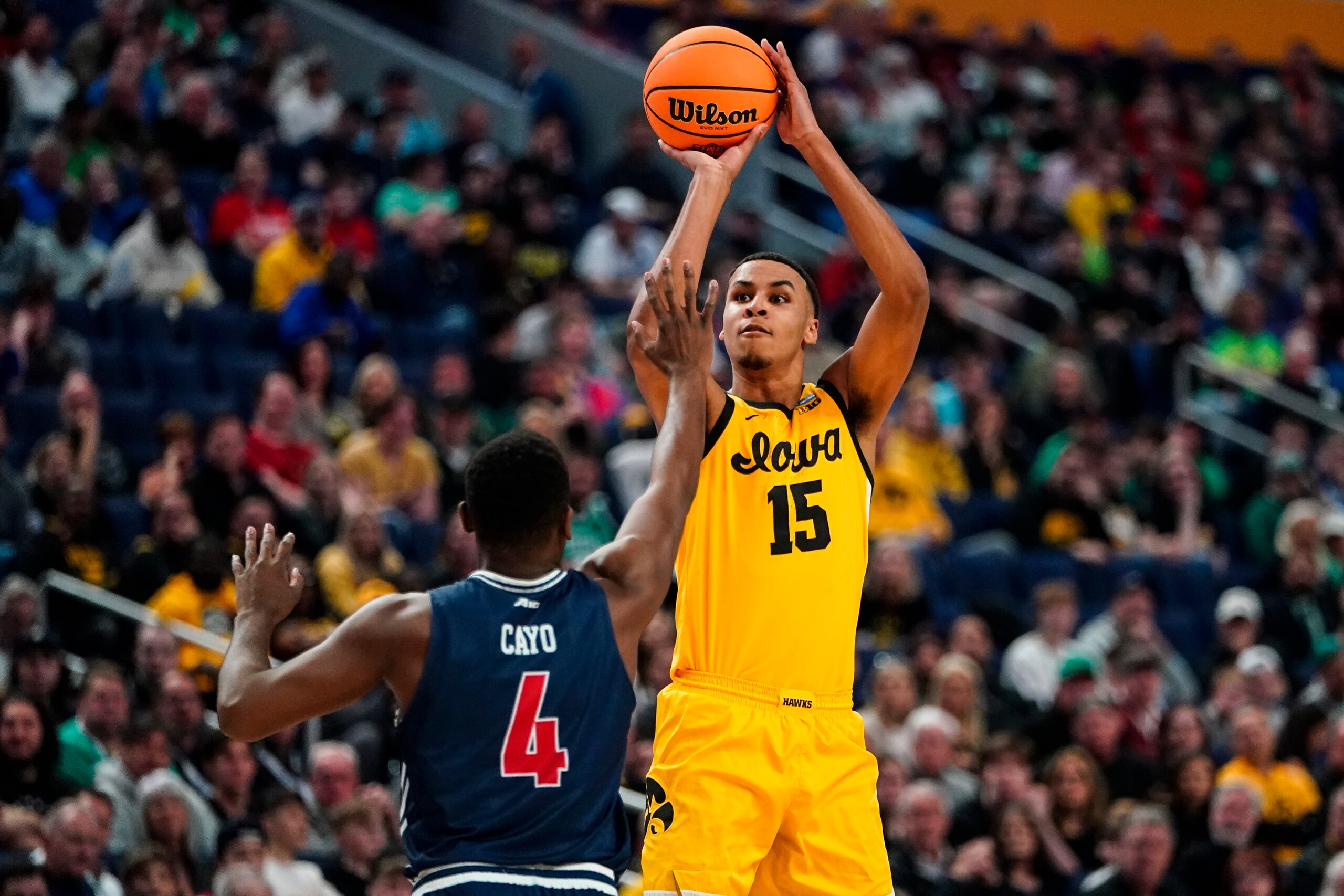 Iowa's Keegan Murray (15) shoots over Richmond's Nathan Cayo (4) in the first half of a college basketball game during the first round of the NCAA men's tournament Thursday, March 17, 2022, in Buffalo, N.Y. (AP Photo/Frank Franklin II)