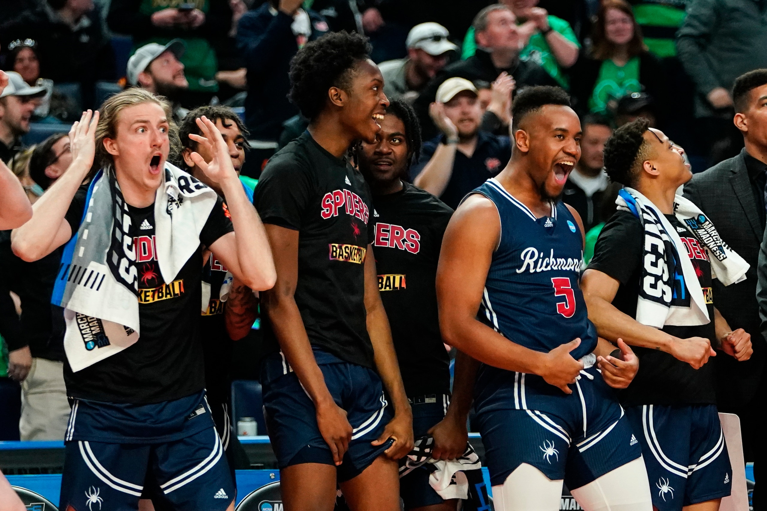 Richmond's Nick Sherod (5) celebrates with teammates in the second half of a college basketball game against the Iowa during the first round of the NCAA men's tournament, Thursday, March 17, 2022, in Buffalo, N.Y. (AP Photo/Frank Franklin II)