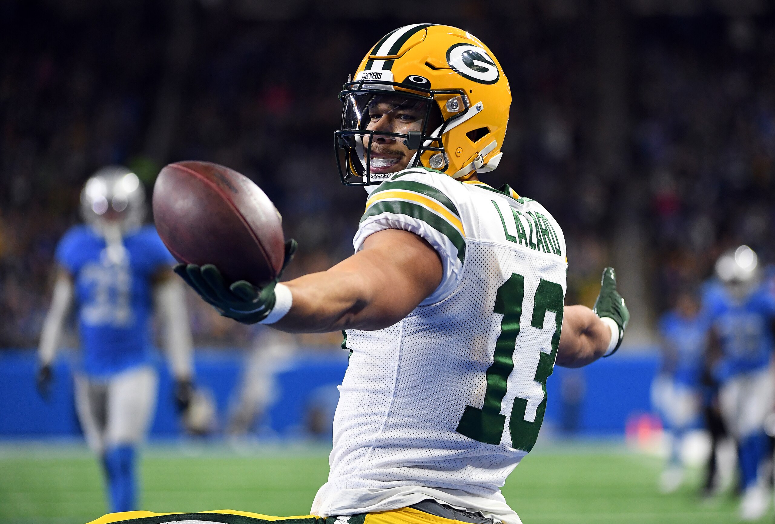 DETROIT, MICHIGAN - JANUARY 09: Allen Lazard #13 of the Green Bay Packers celebrates after catching a touchdown pass during the second quarter against the Detroit Lions at Ford Field on January 09, 2022 in Detroit, Michigan. (Photo by Nic Antaya/Getty Images)