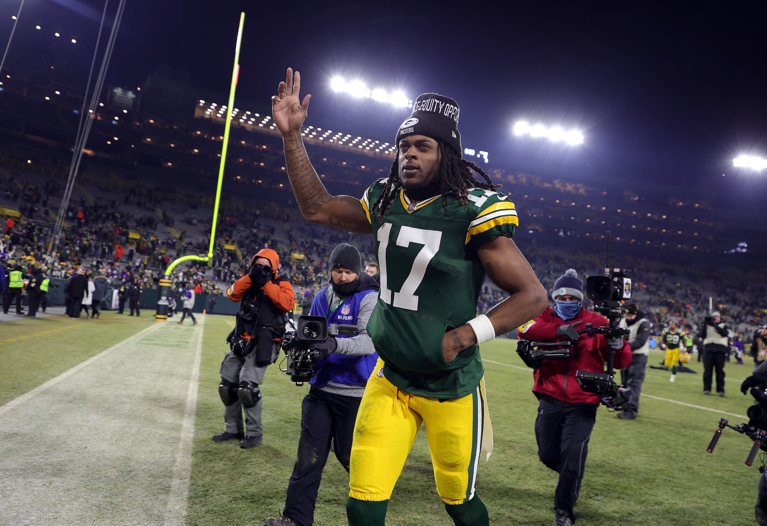 GREEN BAY, WISCONSIN - JANUARY 02:  Wide receiver Davante Adams #17 of the Green Bay Packers walks off the field after the Packers defeated the Minnesota Vikings 37-10 to win the game at Lambeau Field on January 02, 2022 in Green Bay, Wisconsin. (Photo by Stacy Revere/Getty Images)