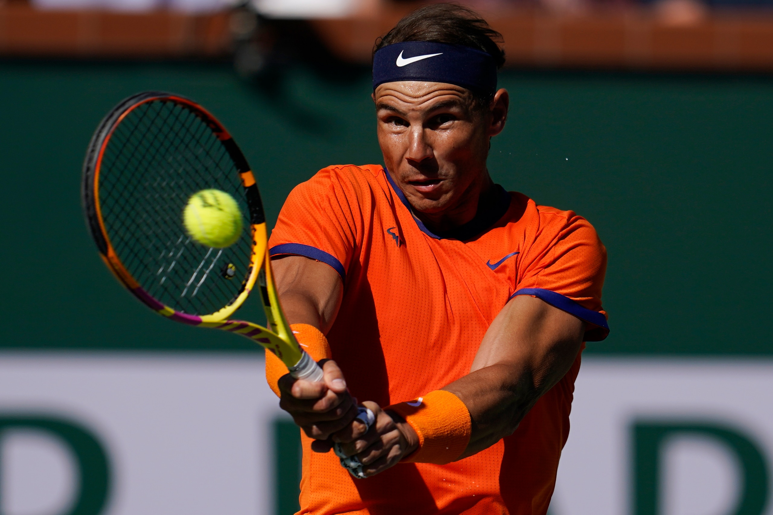 Rafael Nadal, of Spain, returns to Nick Kyrgios, of Australia, during a quarterfinal match in the BNP Paribas Open tennis tournament Thursday, March 17, 2022, in Indian Wells, Calif. (AP Photo/Marcio Jose Sanchez)