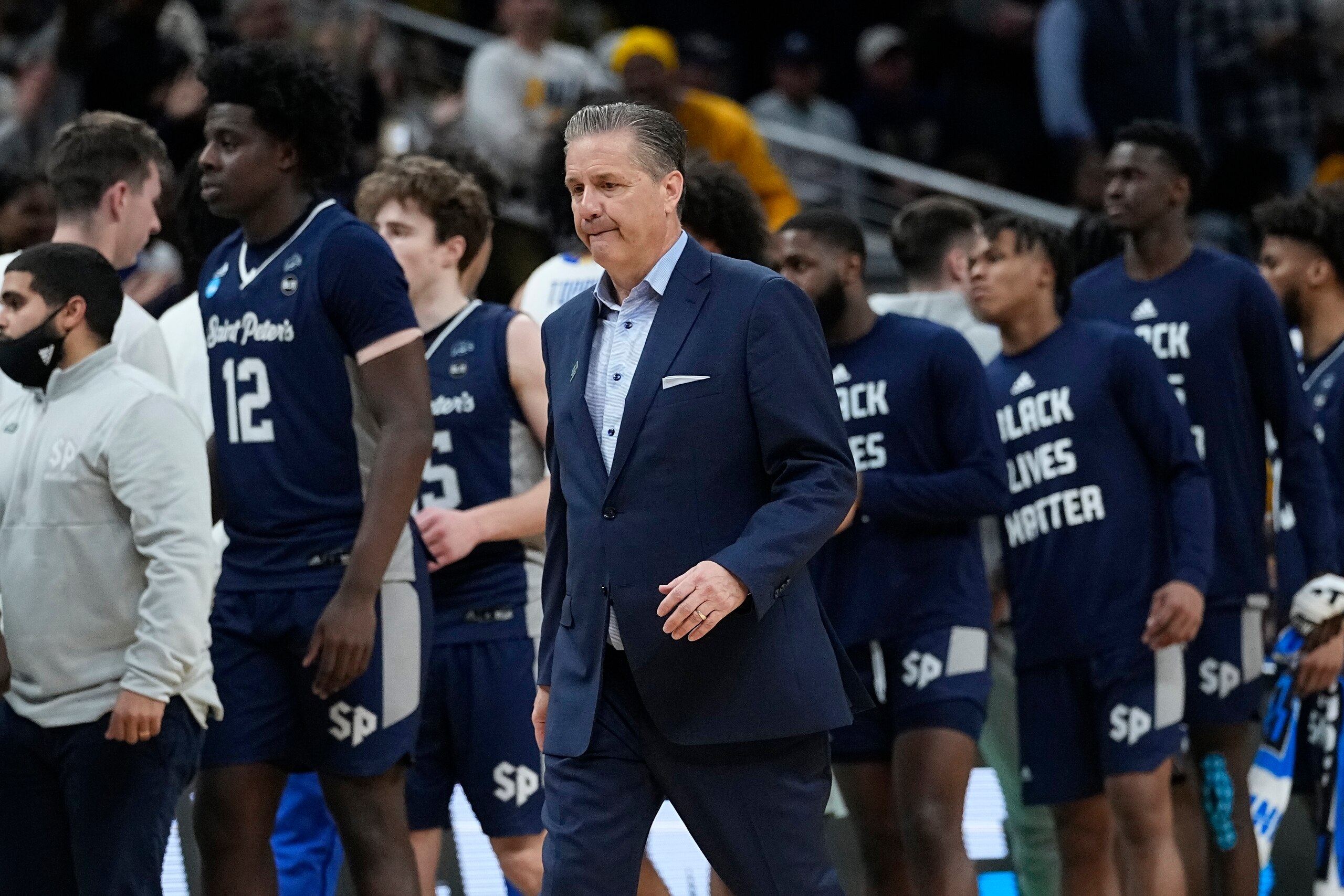 Kentucky head coach John Calipari walks off the court at the end of a college basketball game against Saint Peter's in the first round of the NCAA tournament, Thursday, March 17, 2022, in Indianapolis. Saint Peter's won 85-79 in overtime. (AP Photo/Darron Cummings)
