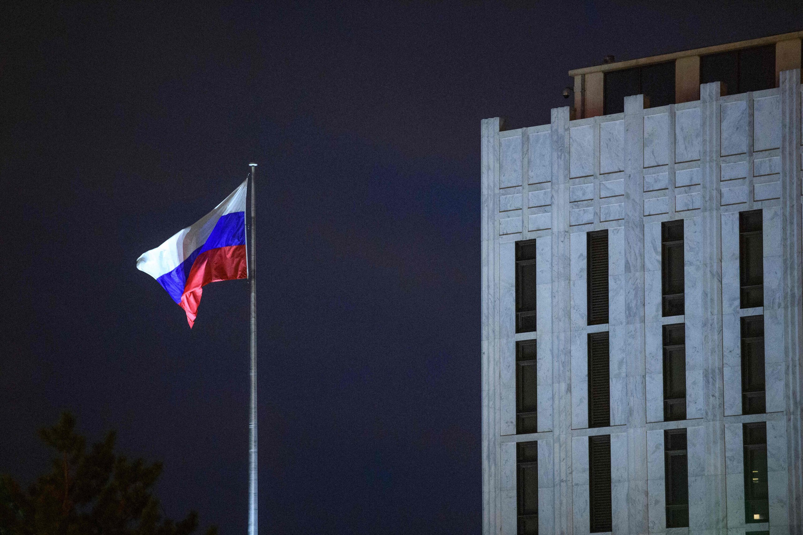 The Russian flag flies above the Embassy of Russia in Washington, DC, on March 3, 2022. (Photo by MANDEL NGAN / AFP) (Photo by MANDEL NGAN/AFP via Getty Images)