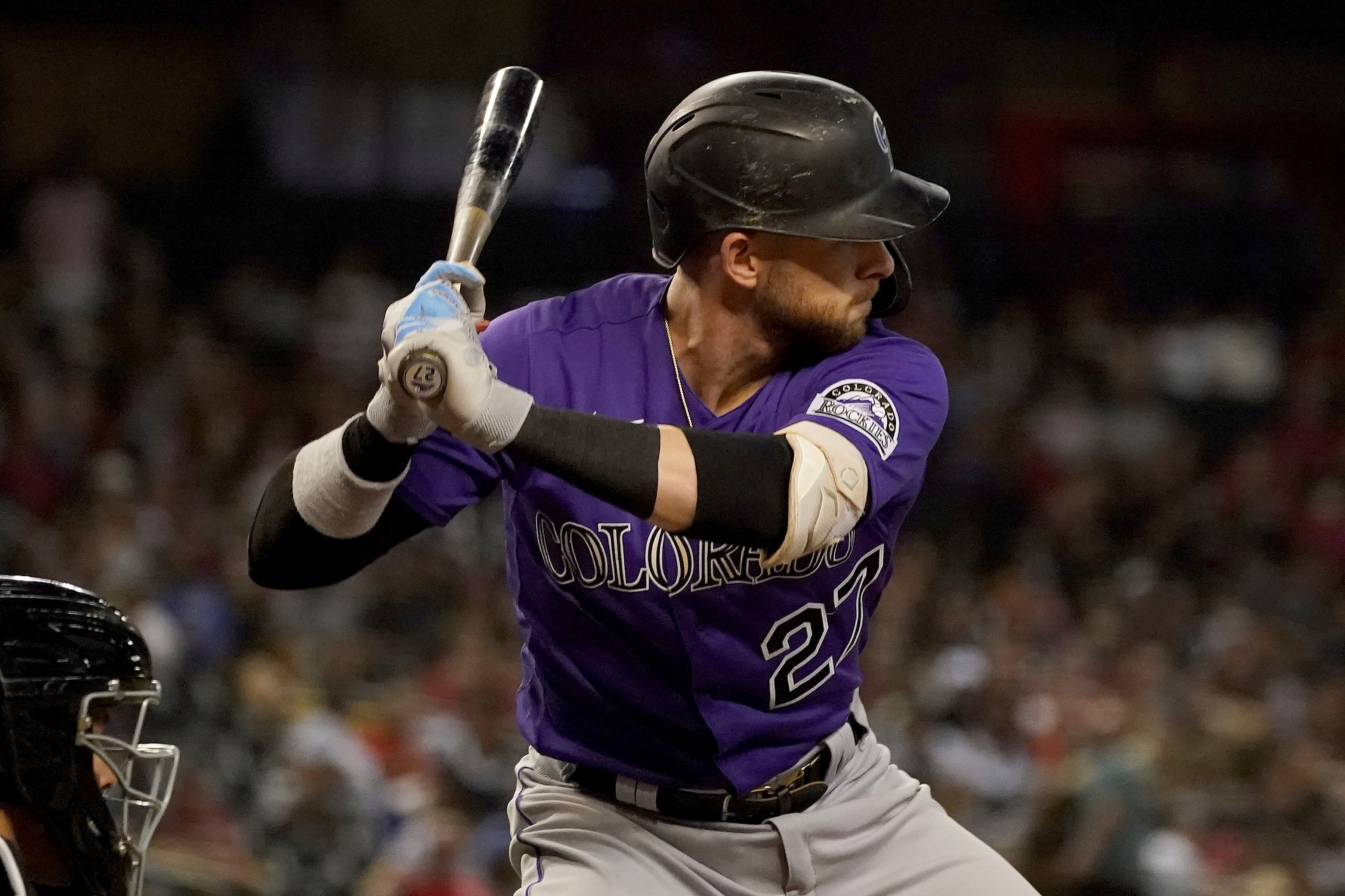 Colorado Rockies shortstop Trevor Story (27) looks for a pitch during the sixth inning of a baseball game with the Arizona Diamondbacks Friday, Oct 1, 2021, in Phoenix. (AP Photo/Darryl Webb)