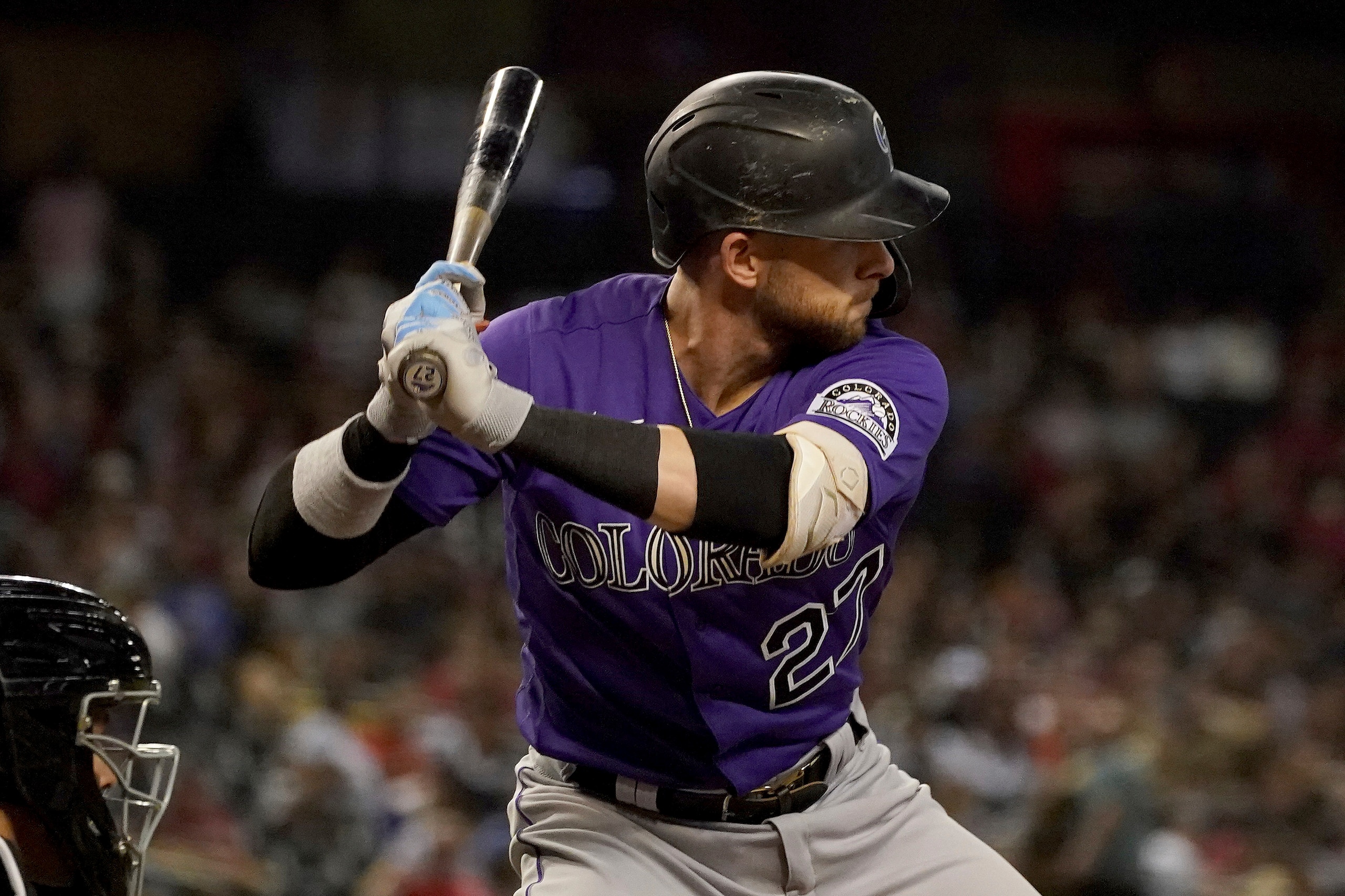 Colorado Rockies shortstop Trevor Story (27) looks for a pitch during the sixth inning of a baseball game with the Arizona Diamondbacks Friday, Oct 1, 2021, in Phoenix. (AP Photo/Darryl Webb)