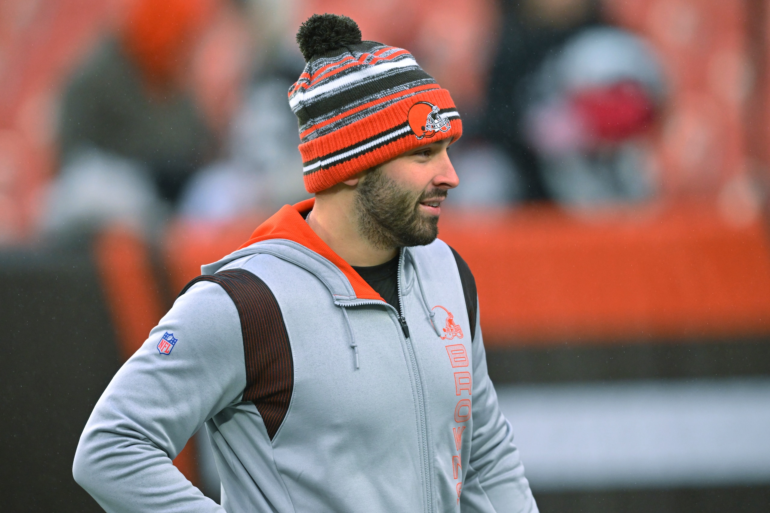 FILE - Cleveland Browns quarterback Baker Mayfield watches teammates warm up for an NFL football game against the Cincinnati Bengals on Jan. 9, 2022, in Cleveland. Knowing he's probably done with the Browns, Mayfield posted a long note on social media, thanking Cleveland and its fans for embracing him and his wife, Emily.(AP Photo/David Richard, File)