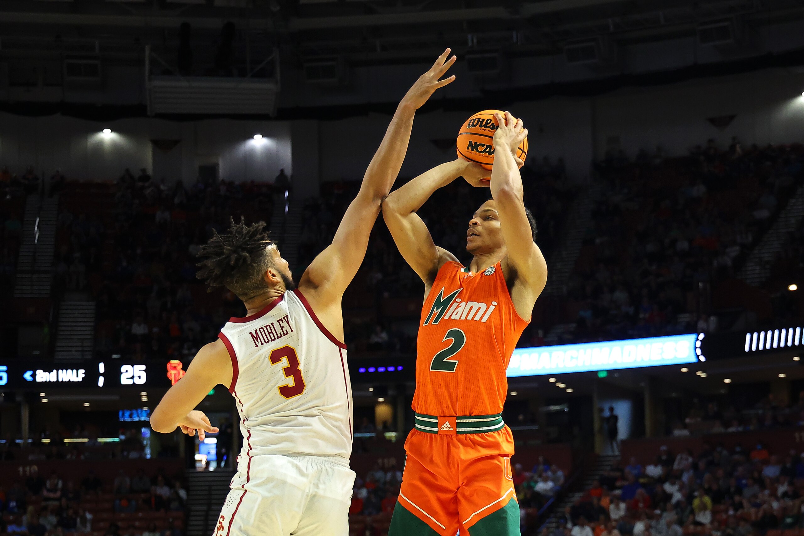 GREENVILLE, SOUTH CAROLINA - MARCH 18: Isaiah Wong #2 of the Miami (Fl) Hurricanes shoots against Isaiah Mobley #3 of the USC Trojans during the second half in the first round game of the 2022 NCAA Men's Basketball Tournament at Bon Secours Wellness Arena on March 18, 2022 in Greenville, South Carolina. (Photo by Kevin C. Cox/Getty Images)
