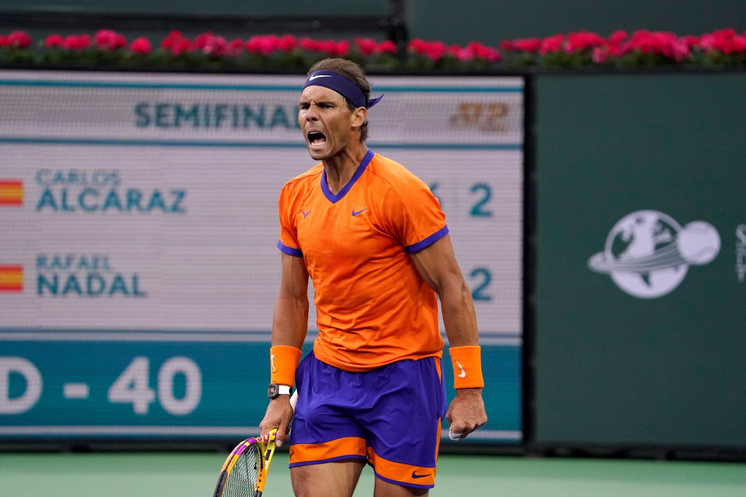 Rafael Nadal, of Spain, celebrates winning a game against Carlos Alcaraz, of Spain, during their men's singles semifinals match at the BNP Paribas Open tennis tournament Saturday, March 19, 2022, in Indian Wells, Calif. (AP Photo/Mark J. Terrill)
