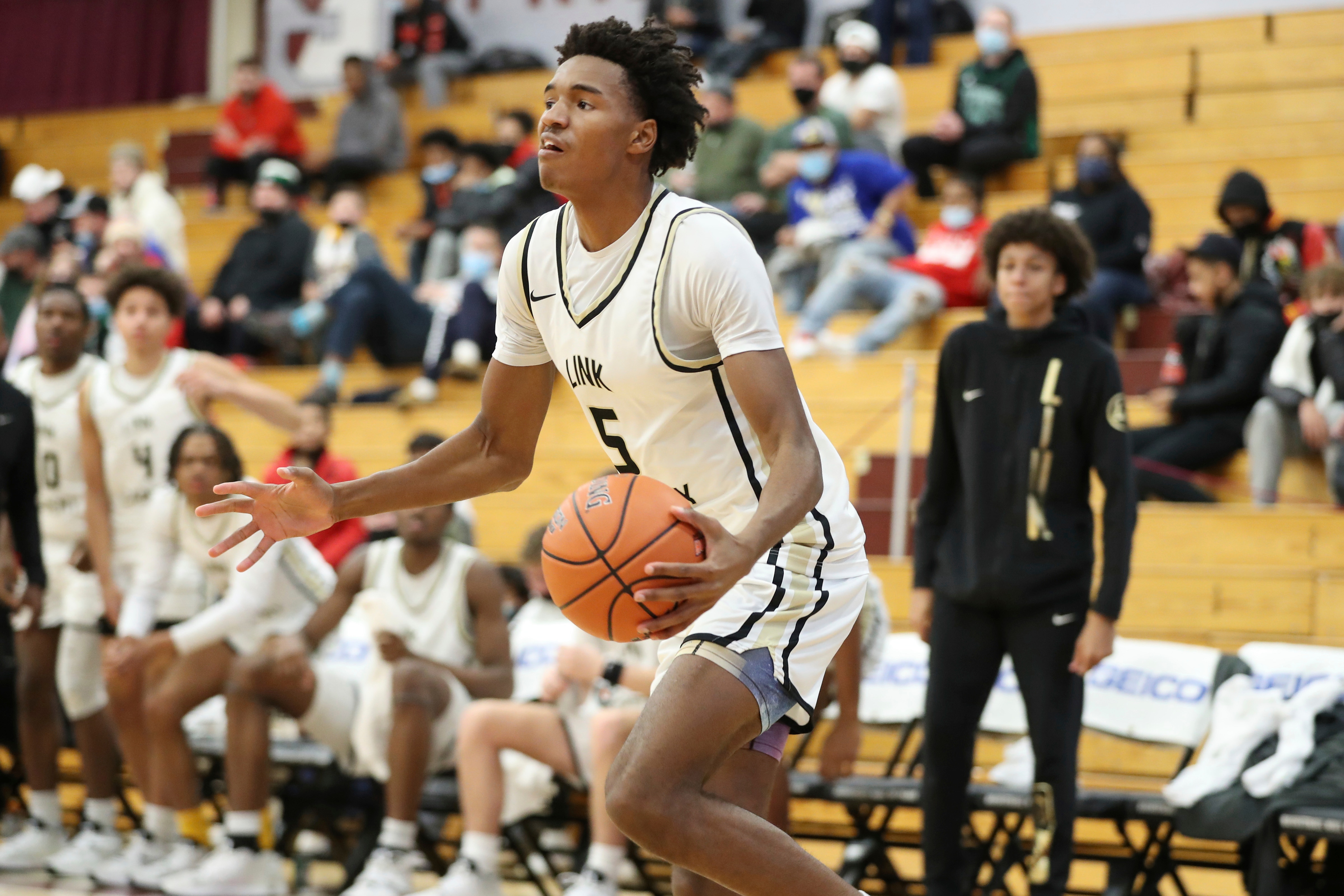 Link Academy's Julian Phillips #5 drives to the Basketball against Prolific Prep during a high school basketball game at the Hoophall Classic, Monday, January 17, 2022, in Springfield, MA. Link won the game. (AP Photo/Gregory Payan)