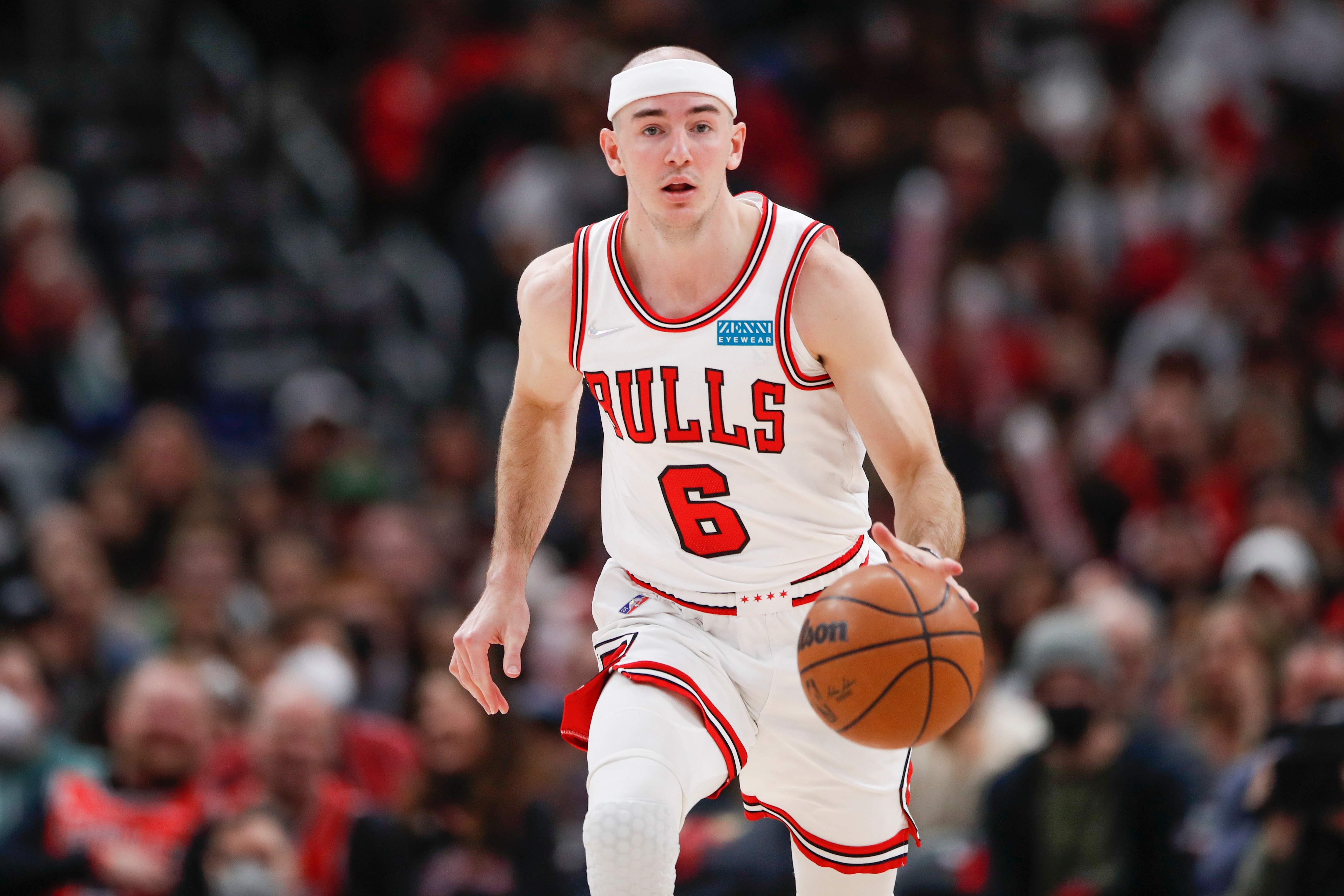 Chicago Bulls guard Alex Caruso (6) brings the ball up court against the Cleveland Cavaliers during the second half of an NBA basketball game, Saturday, March 12, 2022, in Chicago. (AP Photo/Kamil Krzaczynski)
