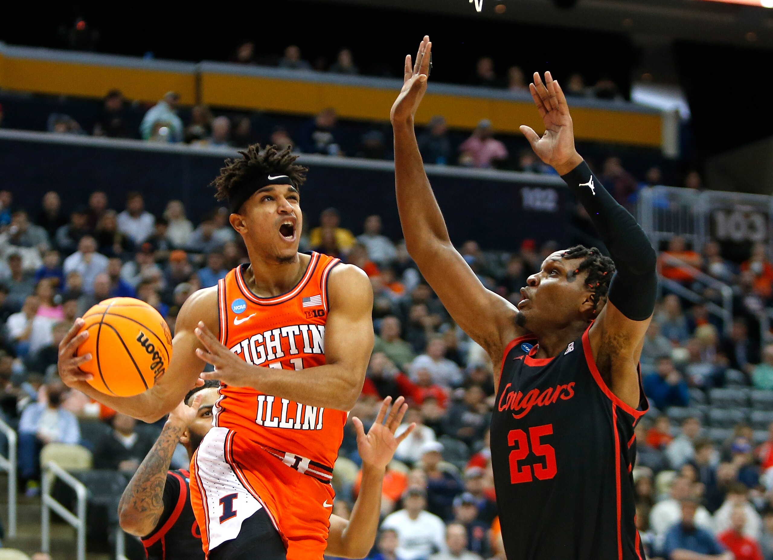 PITTSBURGH, PA - MARCH 20:  Alfonso Plummer #11 of the Illinois Fighting Illini drives past Josh Carlton #25 of the Houston Cougars during the second round of the 2022 NCAA Men's Basketball Tournament held at PPG PAINTS Arena on March 20, 2022 in Pittsburgh, Pennsylvania. (Photo by Justin K. Aller/NCAA Photos via Getty Images)